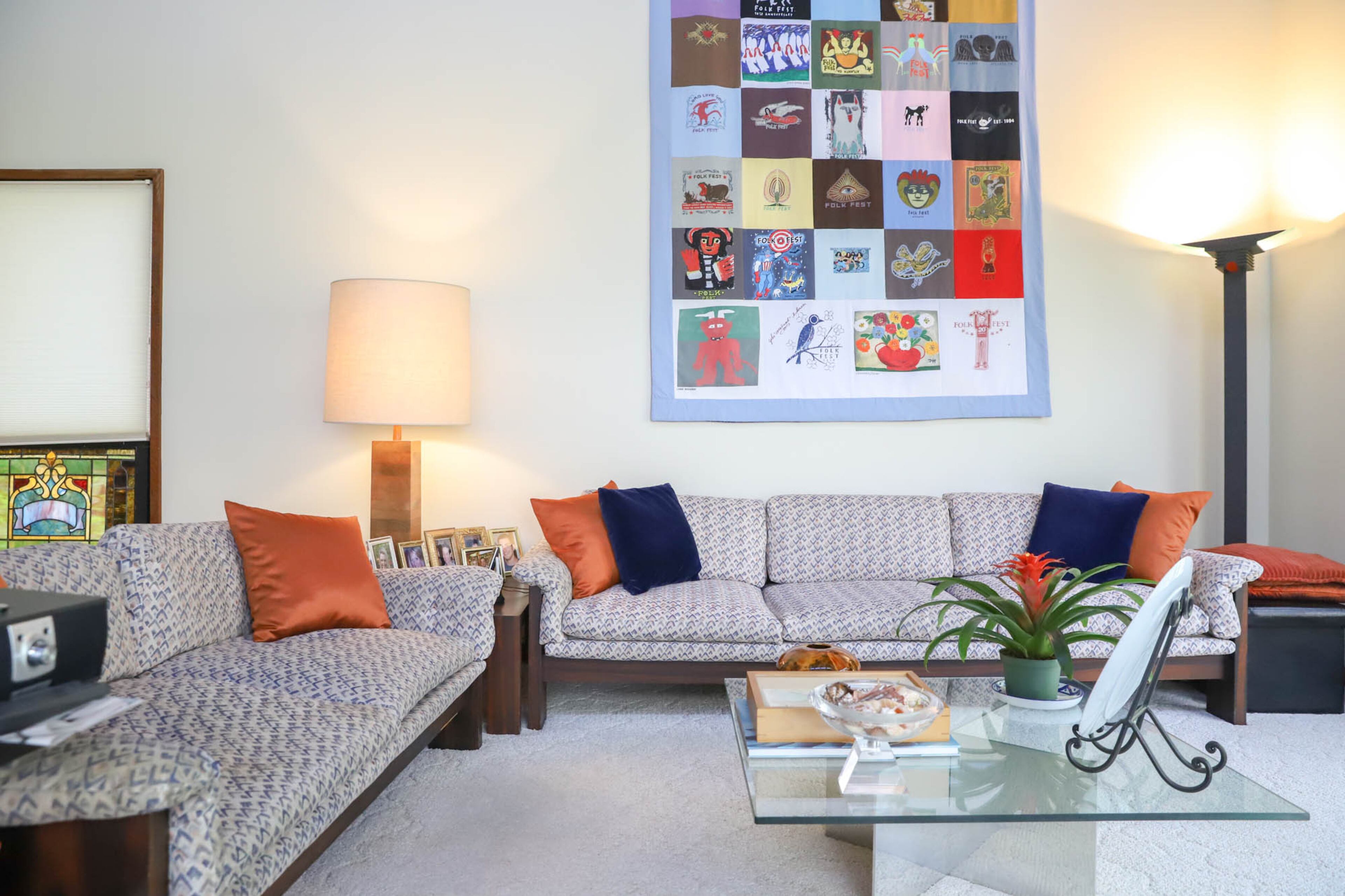 Sofas by Bloom Furniture Company and a glass-topped coffee table from Drexel Heritage create a casual space in the den of Paul and Carol Muldawer’s Buckhead home. On the wall above the sofa hangs a T-shirt quilt that Carol had commissioned by an artist at Atlanta’s now discontinued Folk Fest, made from the T-shirts of previous Folk Fests. Text by Shannon Dominy/Photo by Reynolds Rogers