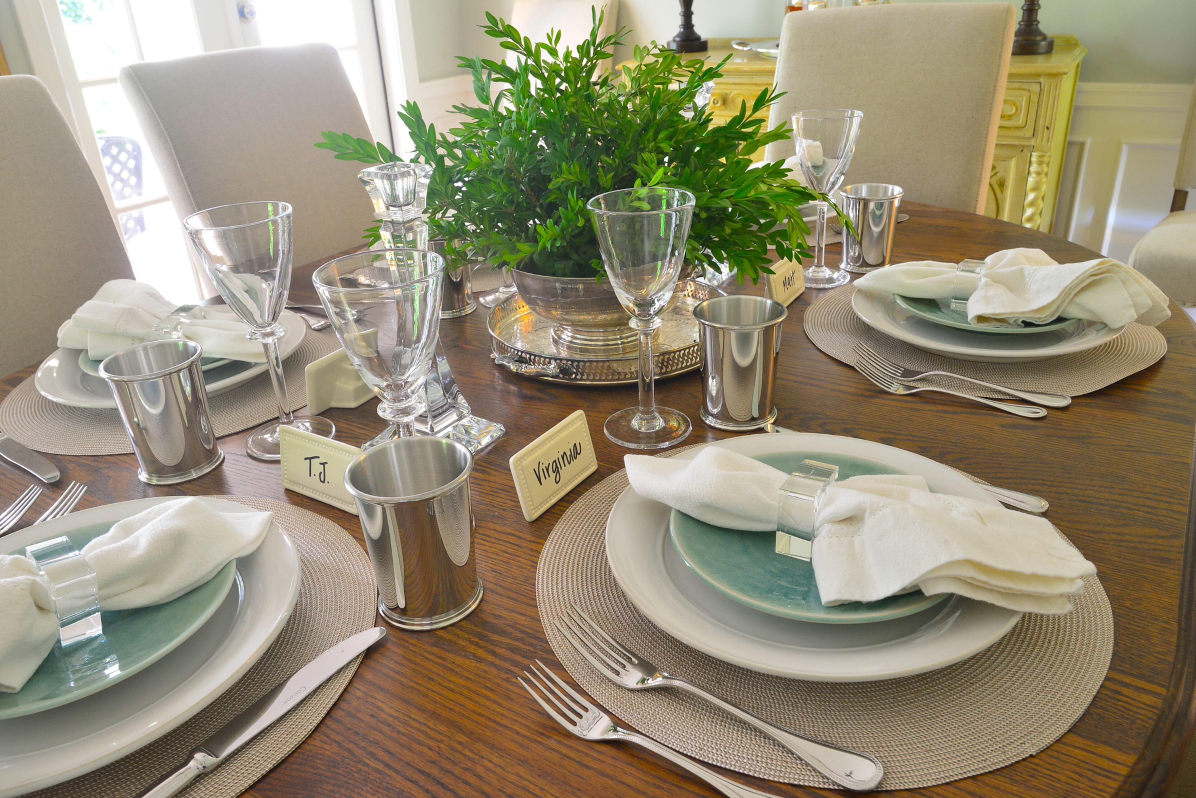 Simon Pearce plates and wine glasses, Jars salad plates and pewter Salisbury julep cups - all from Erika Reade in Atlanta - add a sense of elegant for the table setting in the dining room.
