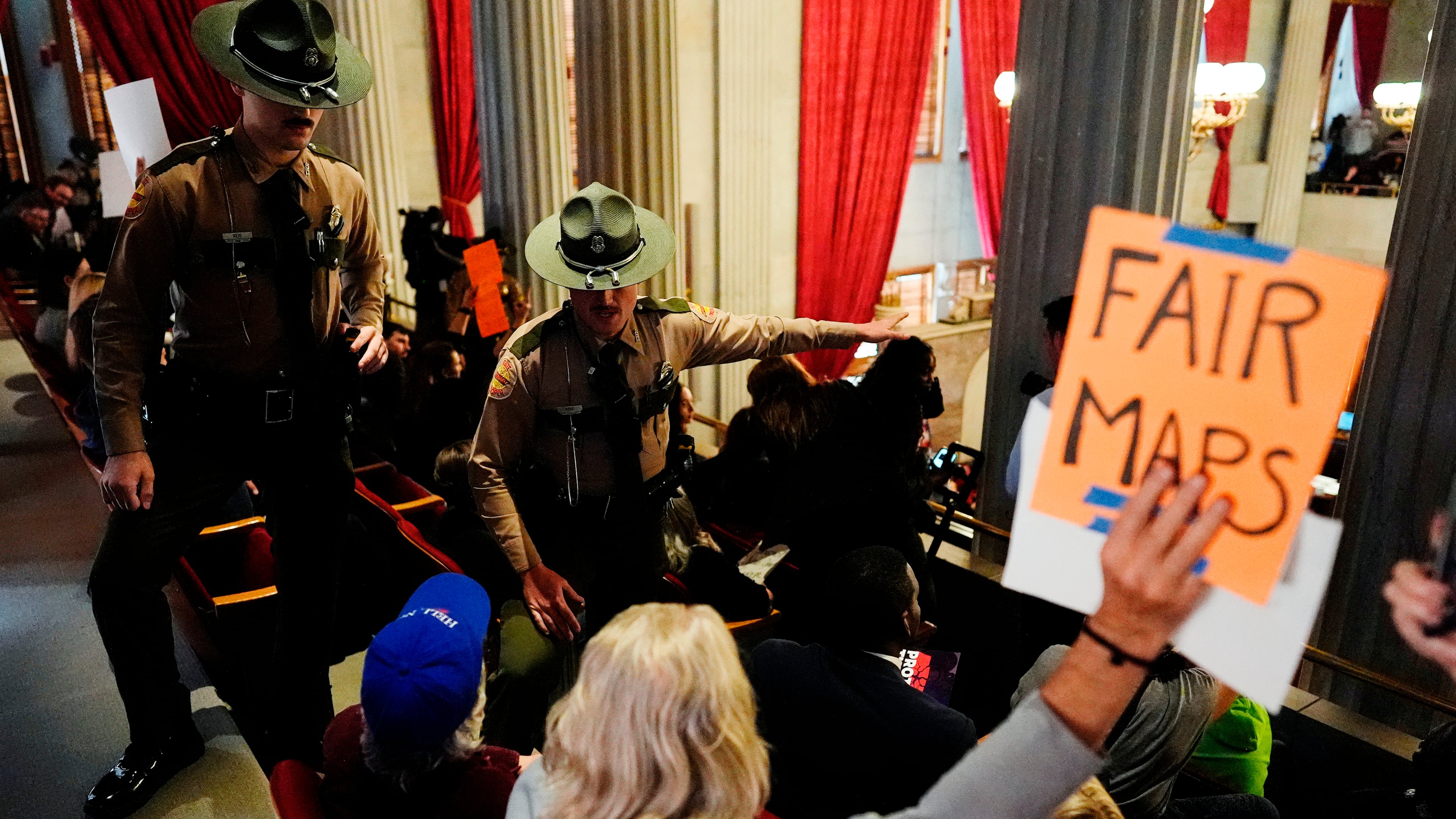State troopers remove people from the House gallery during a special session of the state legislature to redraw U.S. Congressional voting maps Thursday, May 7, 2026, in Nashville, Tenn. (AP Photo/George Walker IV)