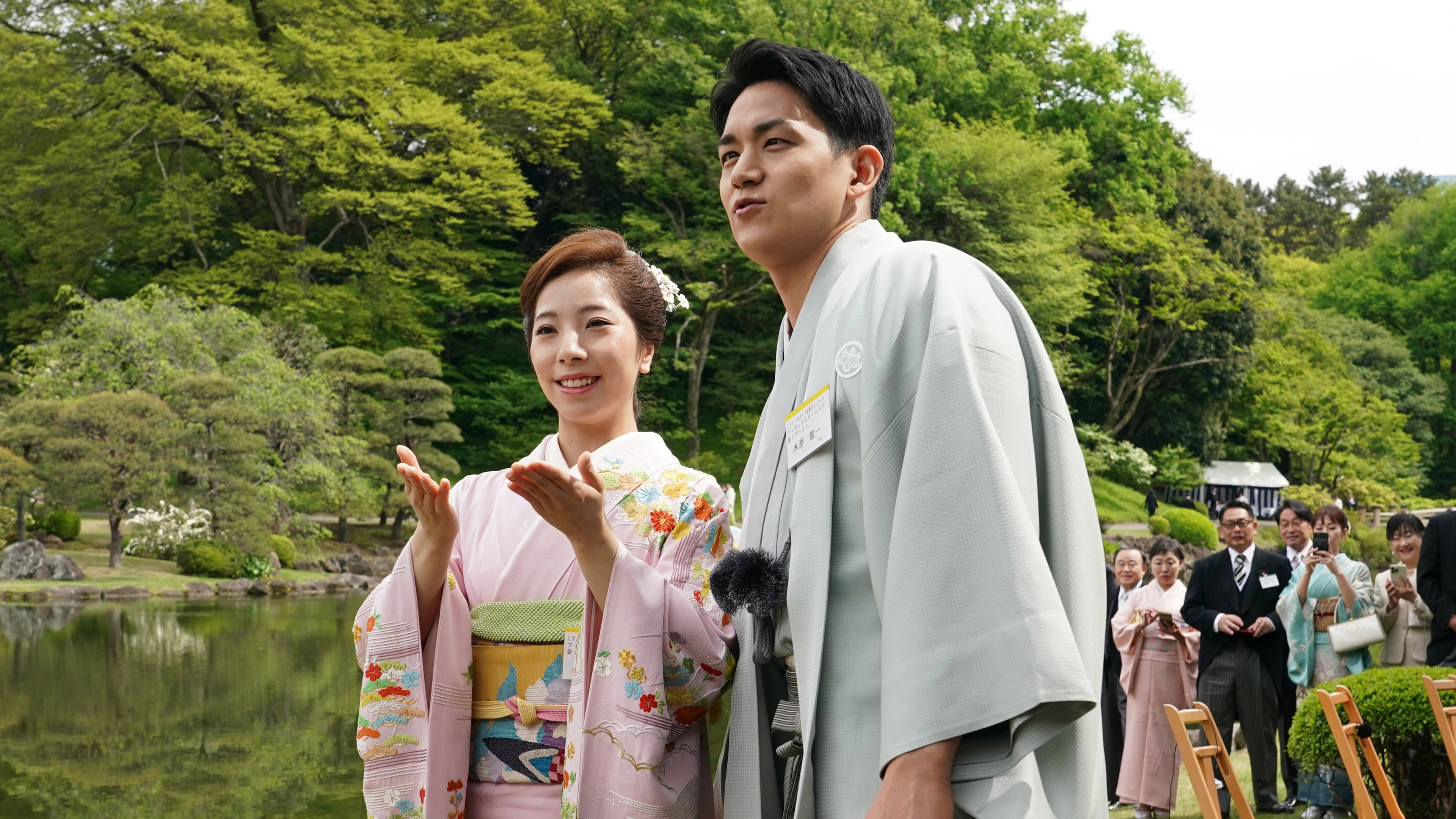 Japanese Olympic figure skating pairs champions Riku Miura, left, and Ryuichi Kihara attend a spring garden party hosted by Japan's Emperor Naruhito and Empress Masako at the Akasaka Palace's imperial garden in Tokyo, Friday, April 17, 2026. (Kazuhiro Nogi/Pool Photo via AP)