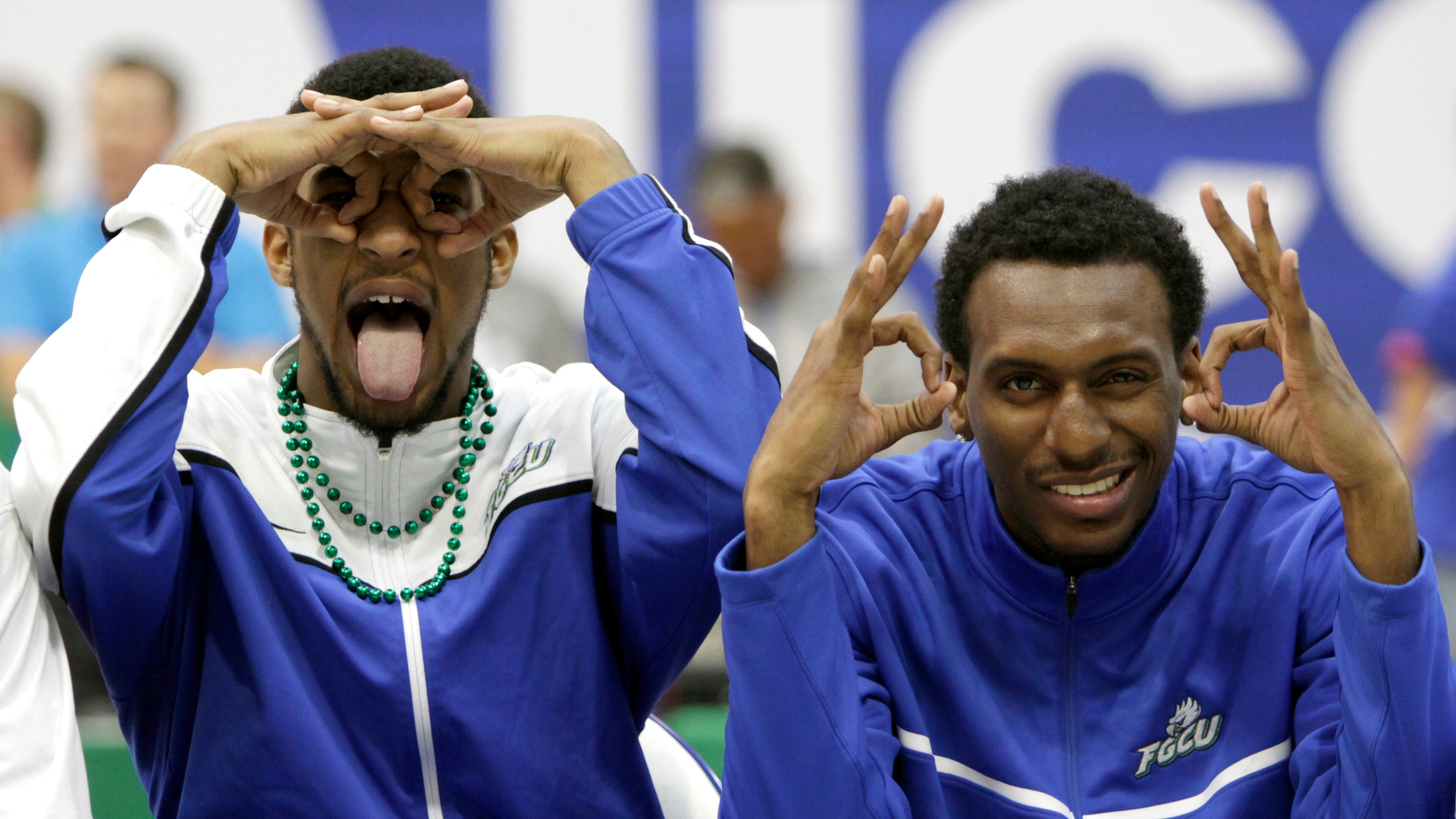 Florida Gulf Coast players Dajuan Graf, left, and Bernard Thompson use their "Eagle Eyes" to view the crowd during a pep rally for the men's basketball team at Alico Arena in Fort Myers, Fla., celebrating their team's to the Sweet 16 in the NCAA college basketball tournament.