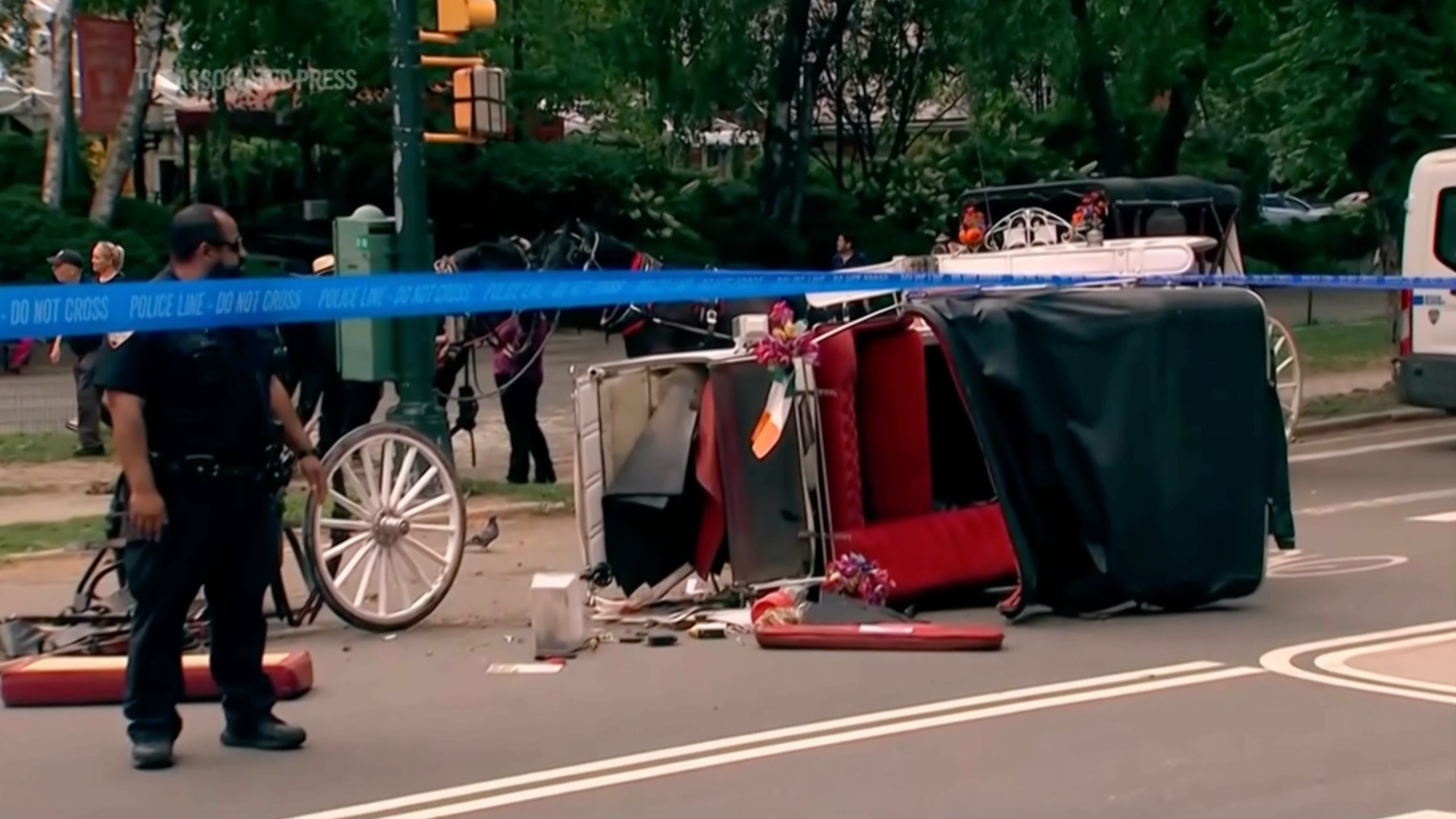 Police investigate the scene after a Central Park carriage horse bolted away from its driver killing a teenager from India on Wednesday, June 17, 2026 in New York. (WABC-TV via AP)