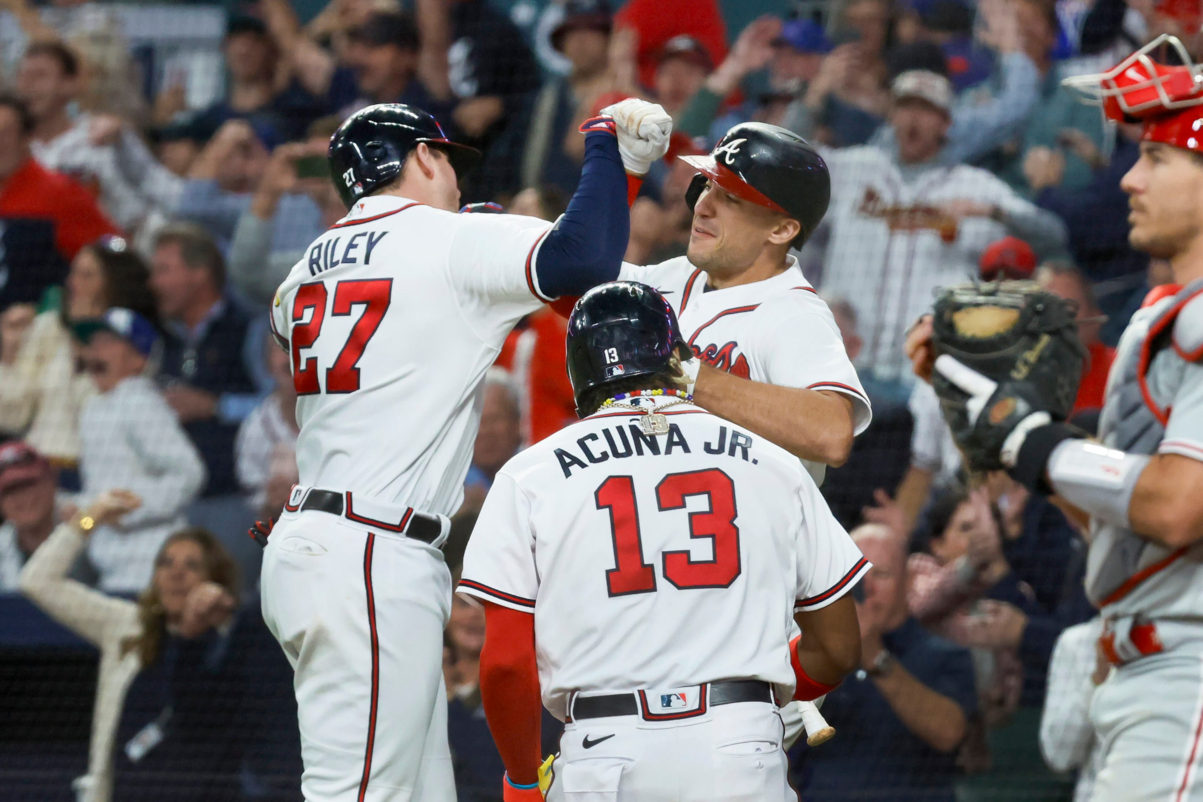 Atlanta Braves third baseman Austin Riley (27) celebrates after a two-run home run against the Philadelphia Phillies during the eighth inning of NLDS Game 2 in Atlanta on Monday, Oct. 9, 2023. (Miguel Martinez / Miguel.Martinezjimenez@ajc.com)