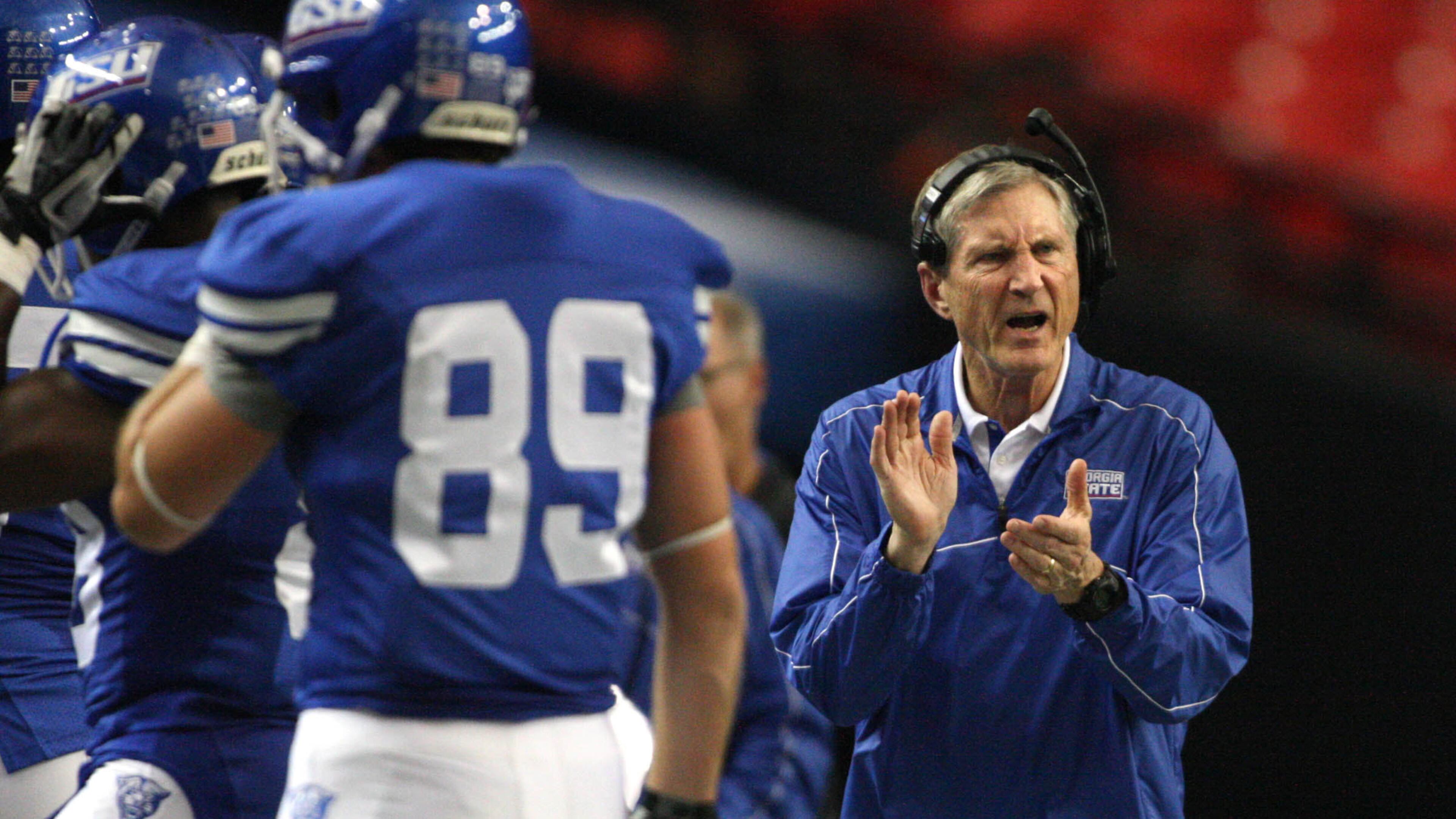 Bill Curry cheers on his Georgia State team in a 2012 game against Villanova at the Georgia Dome. JASON GETZ / JGETZ@AJC.COM