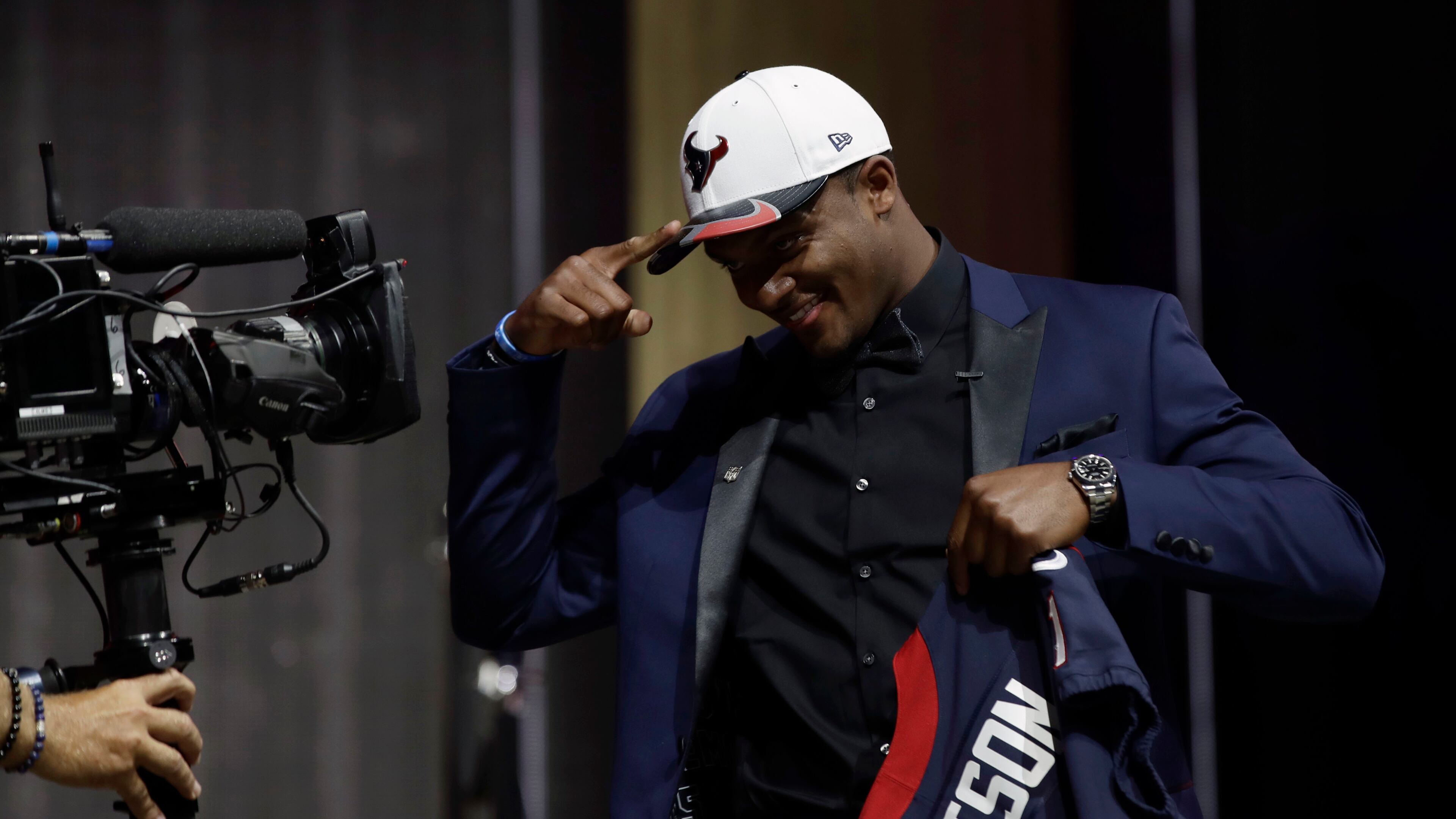 Clemson's Deshaun Watson gestures to a camera after being selected by the Houston Texans during the first round of the 2017 NFL football draft, Thursday, April 27, 2017, in Philadelphia. (AP Photo/Matt Rourke)
