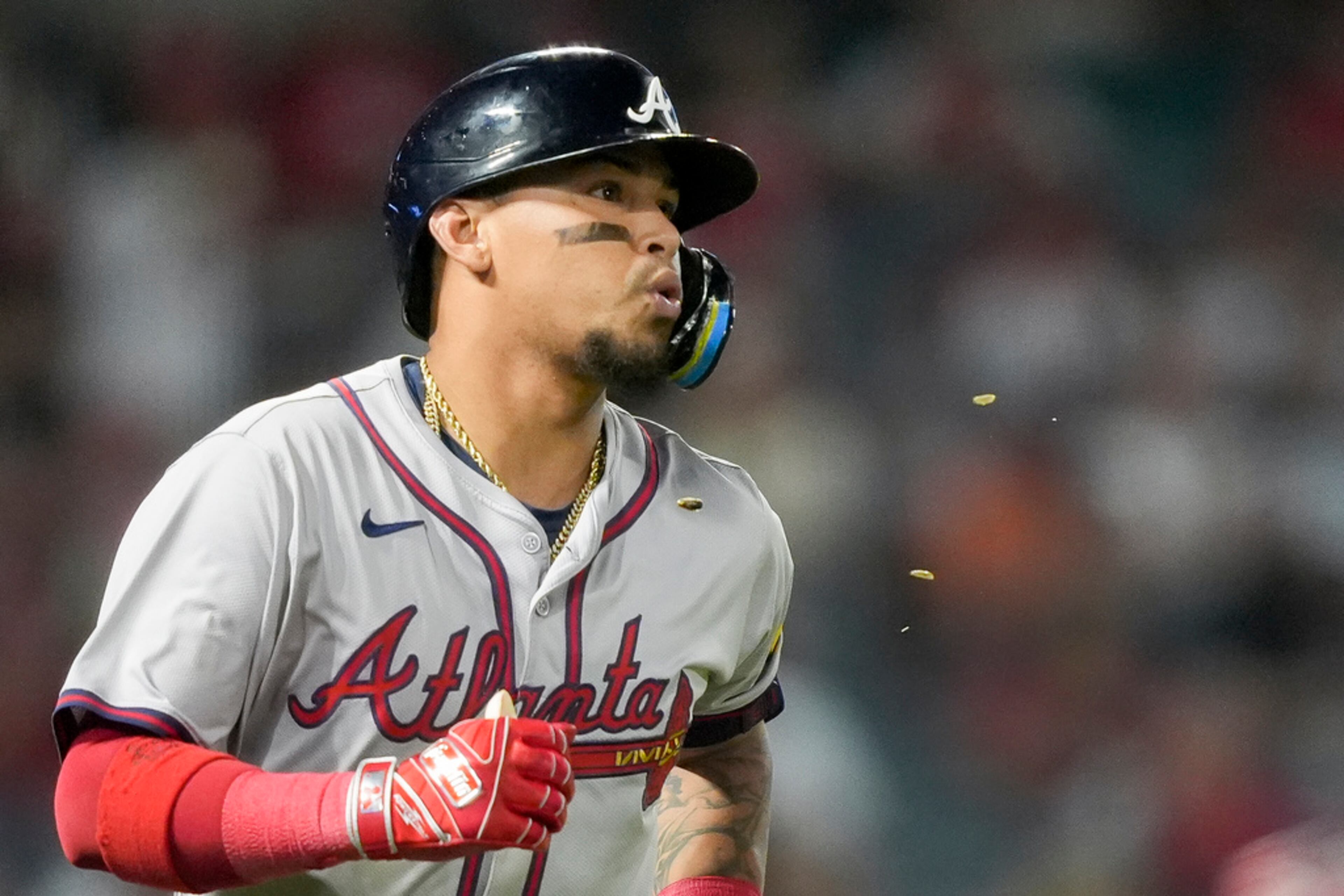 Atlanta Braves' Orlando Arcia spits out sunflower seeds after flying out to Los Angeles Angels right fielder Jo Adell to end the top of the fifth inning of a baseball game Saturday, Aug. 17, 2024, in Anaheim, Calif. (AP Photo/Ryan Sun)