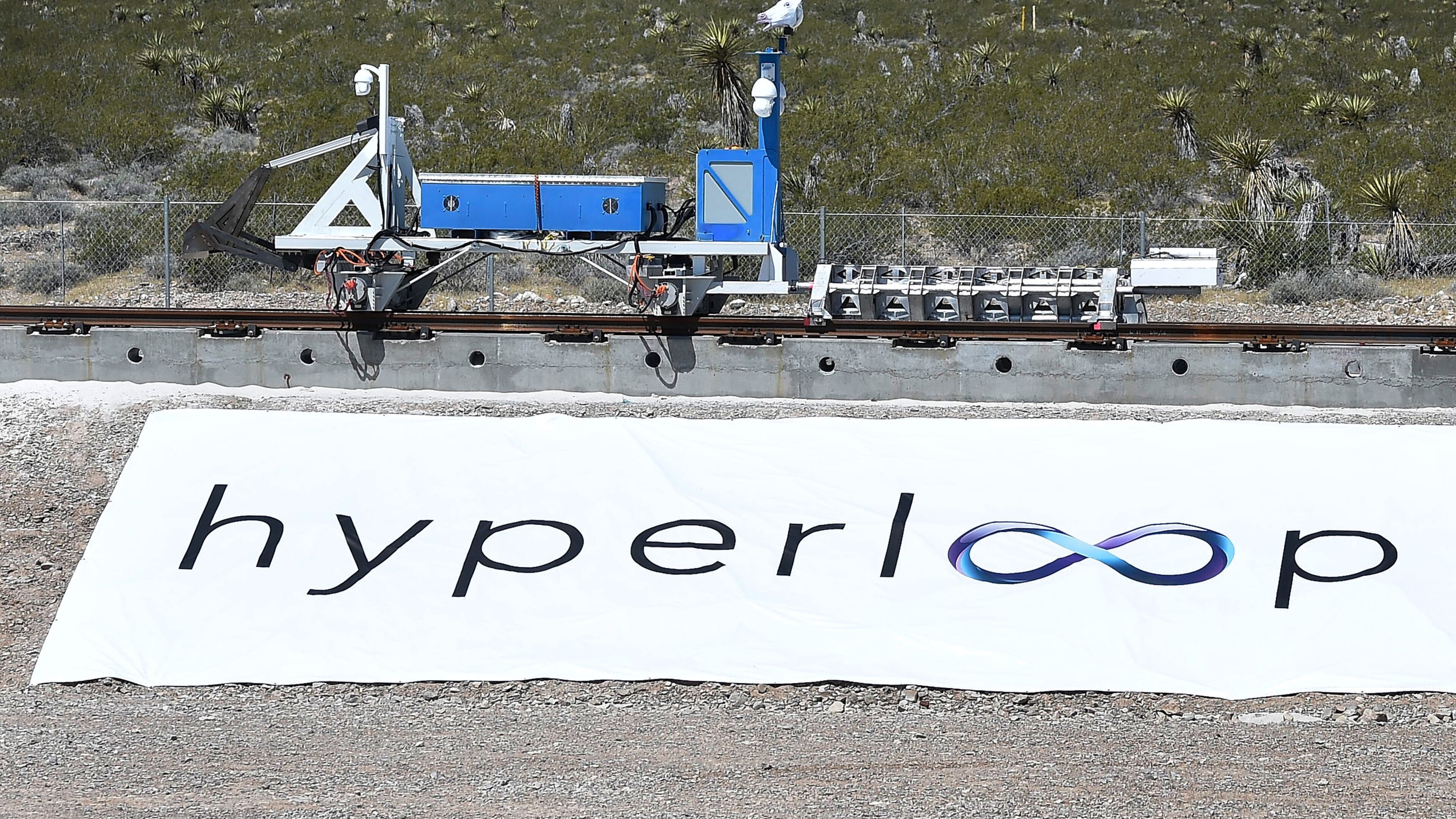 NORTH LAS VEGAS, NV - MAY 11: A recovery vehicle moves a test sled down a track after the first test of the propulsion system at the Hyperloop One Test and Safety site on May 11, 2016 in North Las Vegas, Nevada. The company plans to create a fully operational hyperloop system by 2020. (Photo by David Becker/Getty Images,)