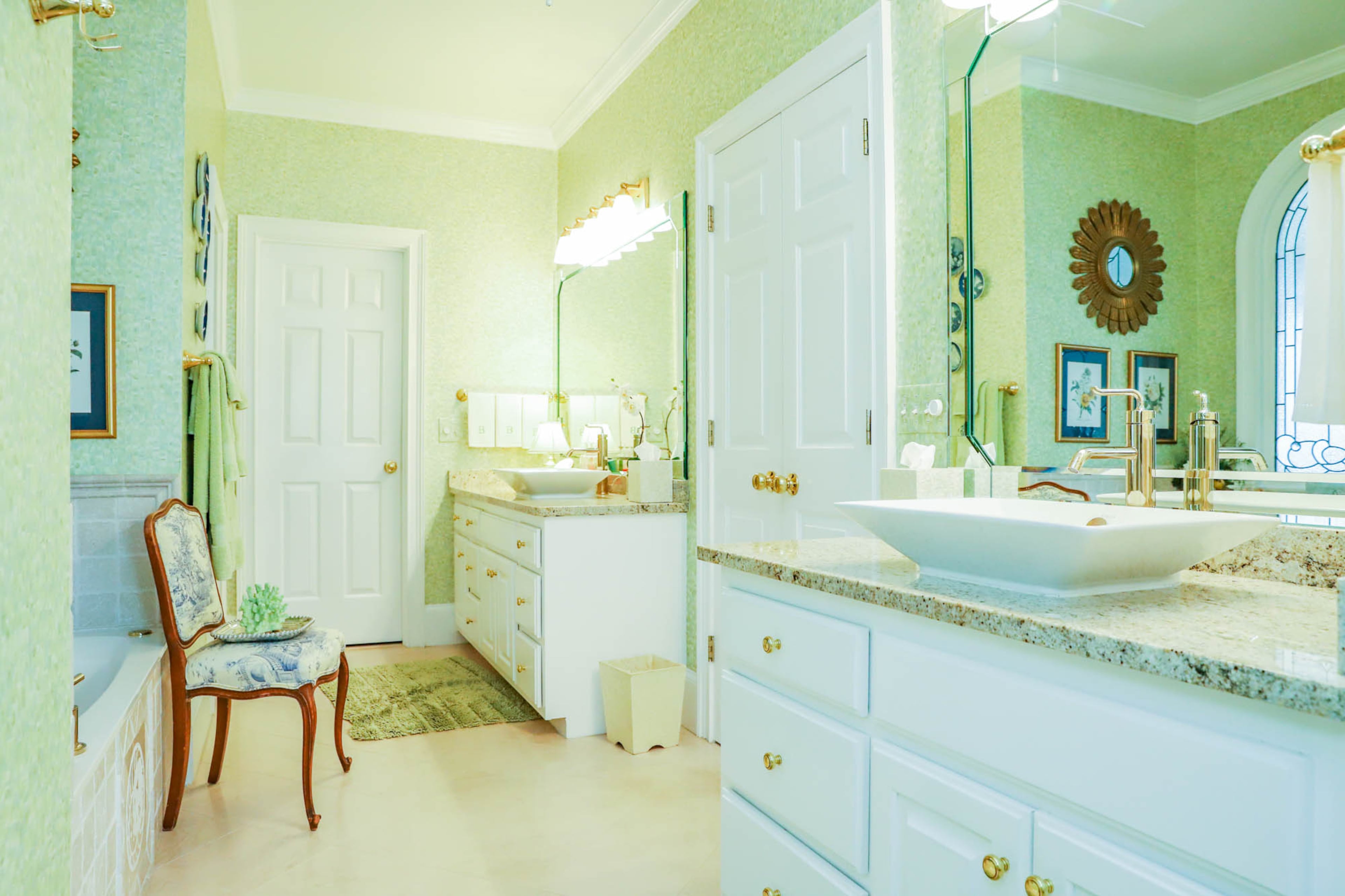 When Richard and Gay Berardi bought their home in 2008, the bathrooms were dated and not their style. In 2010 they renovated their bathroom, working with Nelson Cisneros to paint their cabinets, installing new granite counters and sourcing bright, earthy wallpaper through interior designer Lisa D’Aoust. Text by Shannon Dominy/Photos by Reynolds Rogers