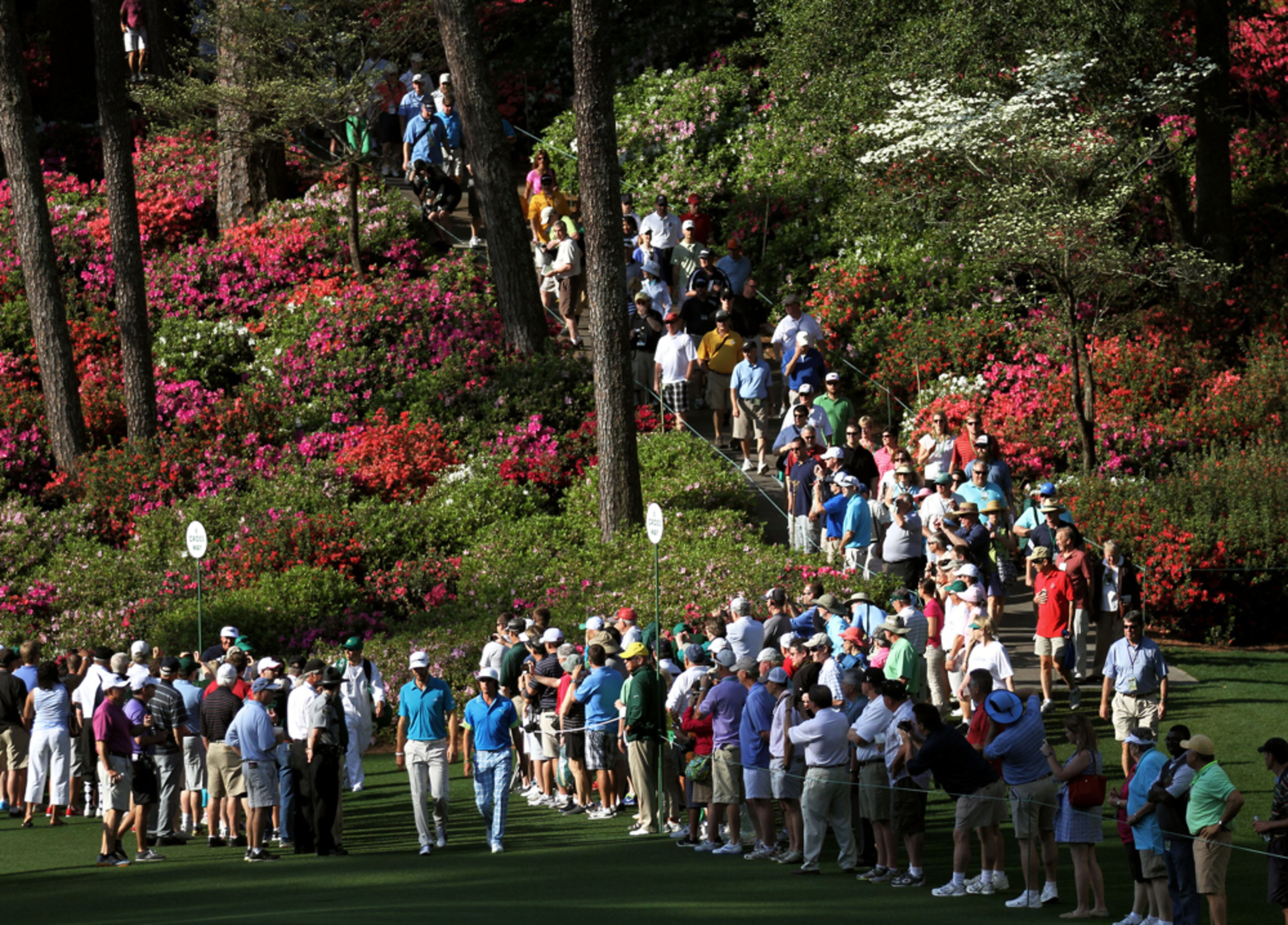 APRIL 9, 2012-AUGUSTA: The crowd watches Dustin Johnson (left) & Rickie Fowler walk to the 6th green during the second day of practice rounds for the Masters Tournament at Augusta National Golf Club on Monday April 8th, 2013. PHIL SKINNER / PSKINNER@AJC.COM
