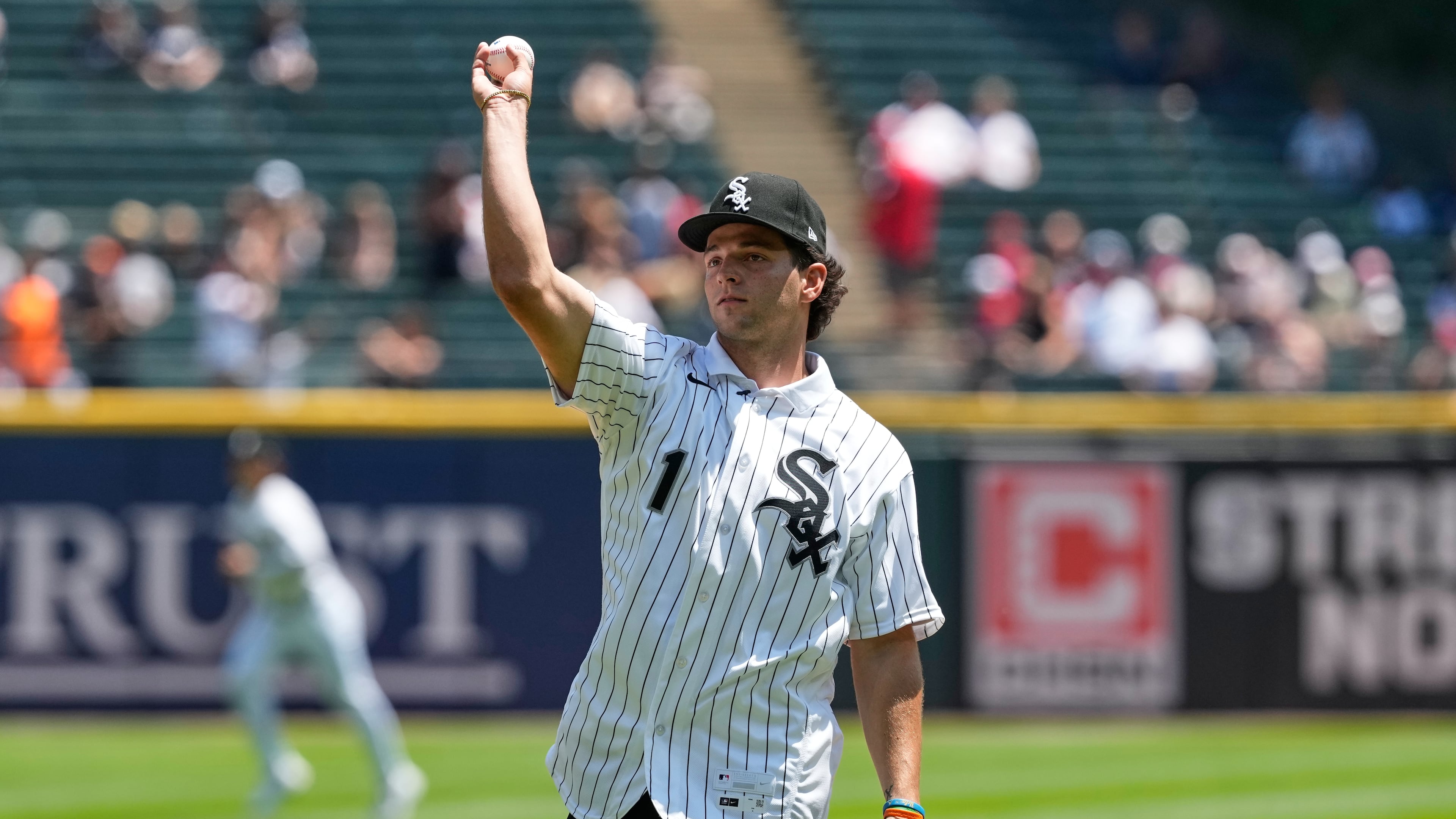 Chicago White Sox's Roch Cholowsky, first round of the 2026 MLB draft (No. 1 overall), throws a ceremonial first pitch before a baseball game between the Athletics and the White Sox in Chicago, Sunday, July 12, 2026. (AP Photo/Nam Y. Huh)
