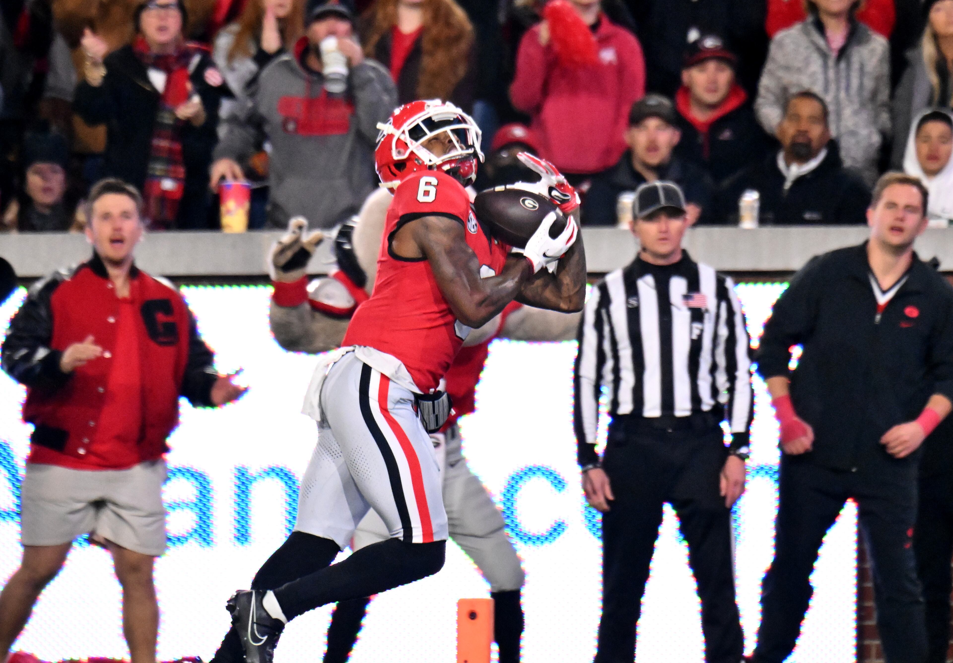 Georgia wide receiver Dominic Lovett (6) makes a touchdown pass during the first half of an NCAA college football game at Georgia Tech's Bobby Dodd Stadium, Saturday, November 25, 2023, in Atlanta. (Hyosub Shin / Hyosub.Shin@ajc.com)