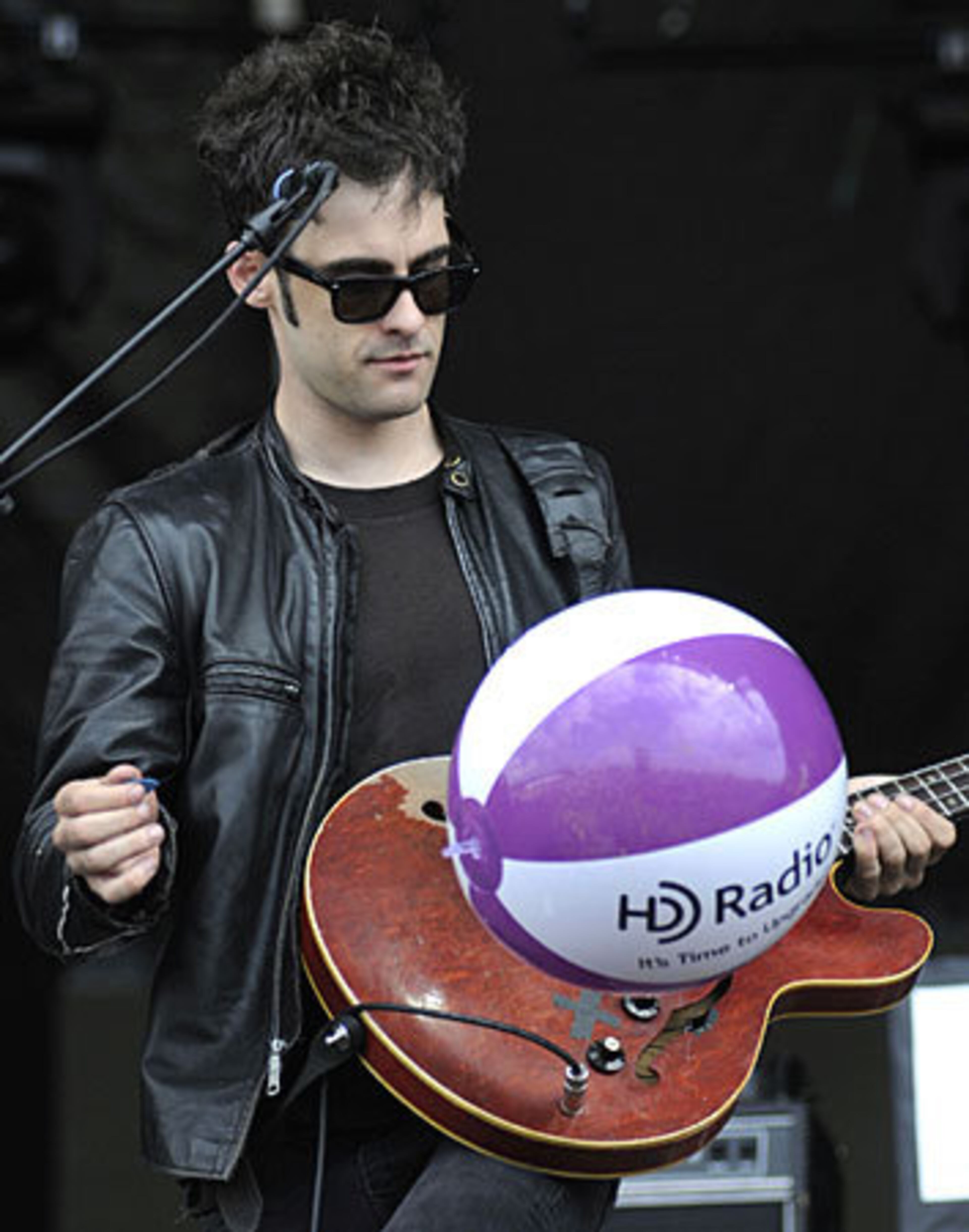 Robert Levon Been of the Black Rebel Motorcycle Club watches a beach ball bounce off his bass guitar at the Virgin Mobile Festival.