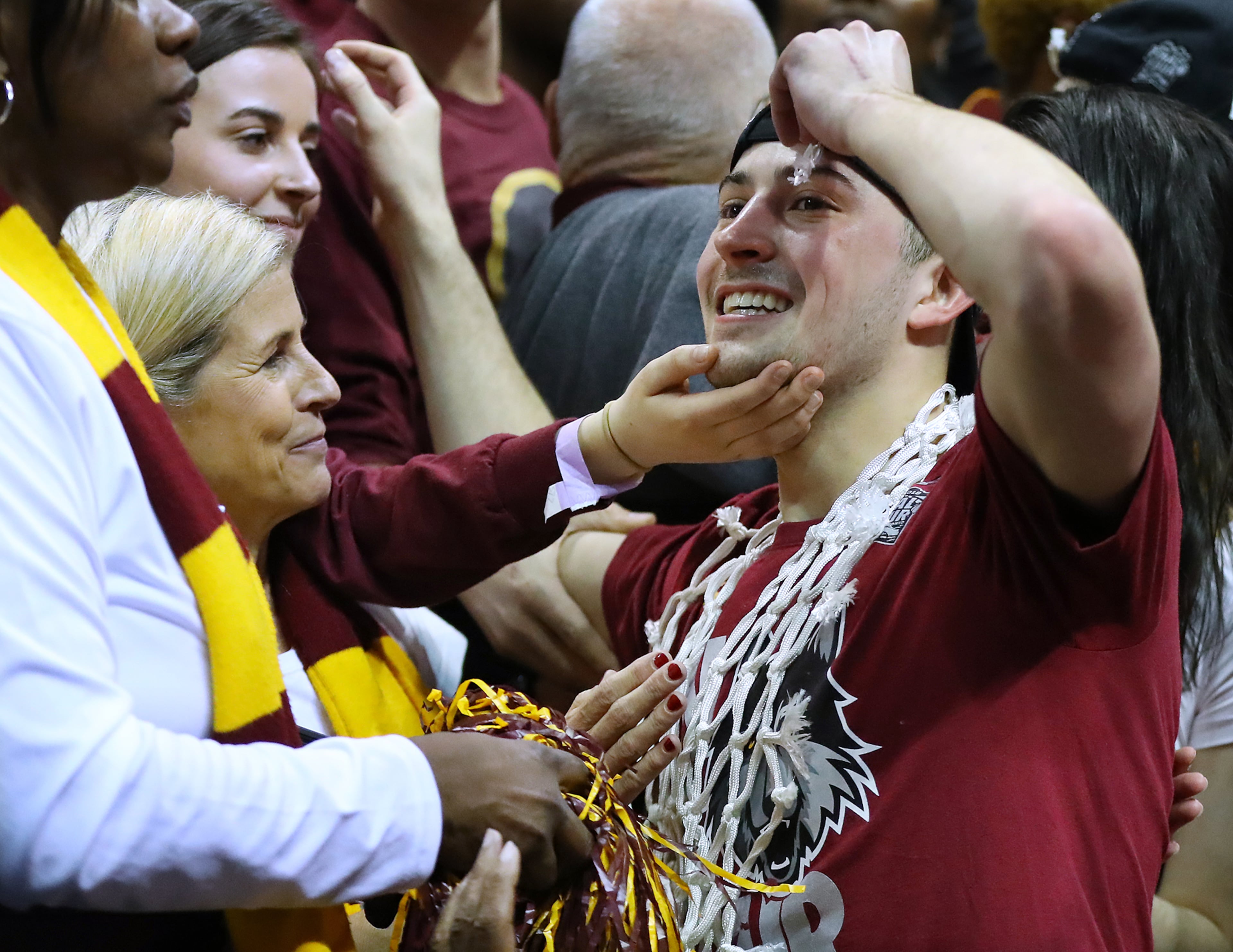 March 24, 2018 Atlanta: Loyola guard Ben Richardson celebrates with fans after beating Kansas State 78-62 in their regional final NCAA college basketball game on Saturday, March 24, 2018, in Atlanta. Curtis Compton/ccompton@ajc.com
