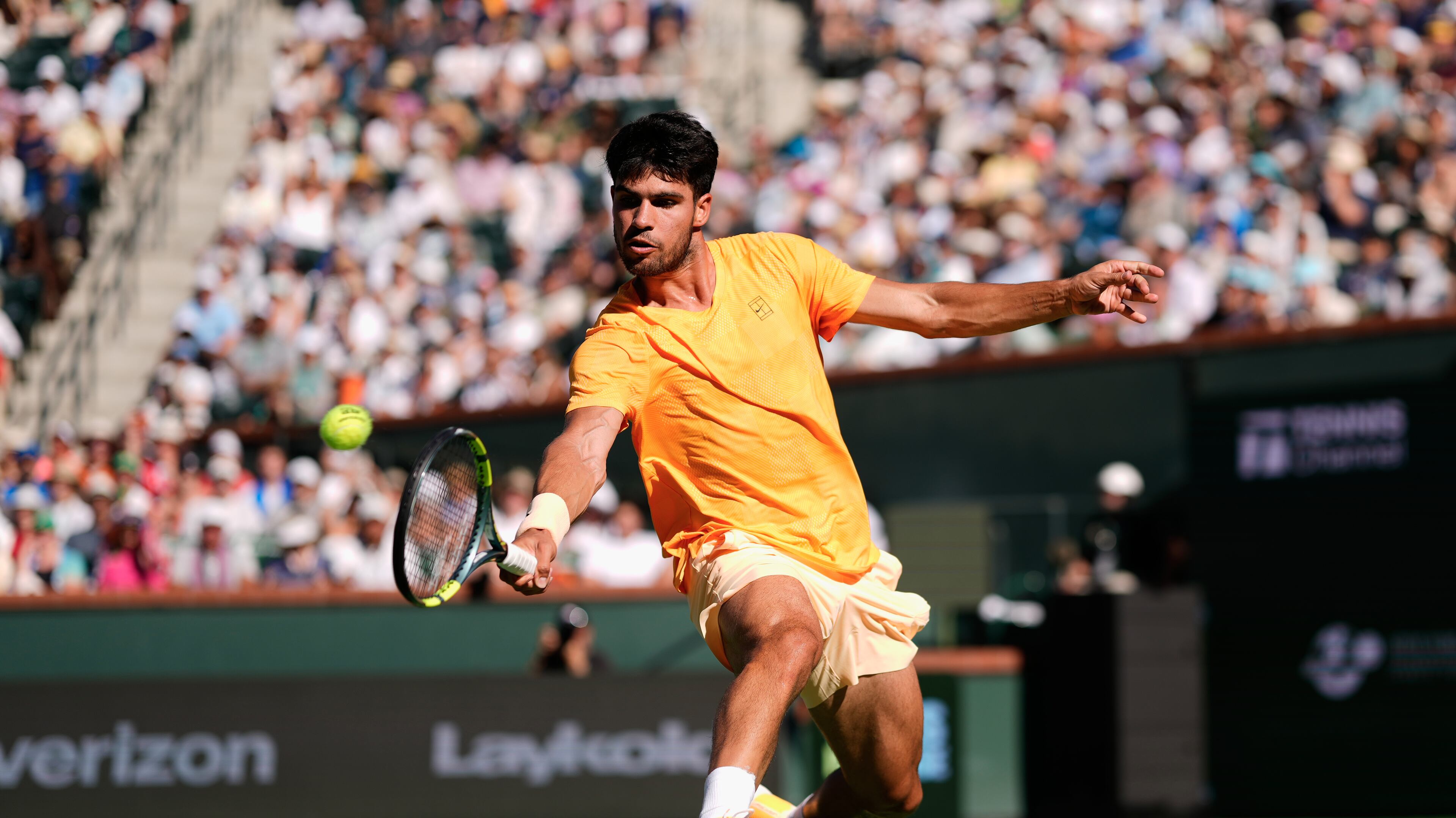 FILE - Carlos Alcaraz, of Spain, returns a shot against Daniil Medvedev, of Russia, during a semifinal match at the BNP Paribas Open tennis tournament, March 14, 2026, in Indian Wells, Calif. (AP Photo/Mark J. Terrill, File)