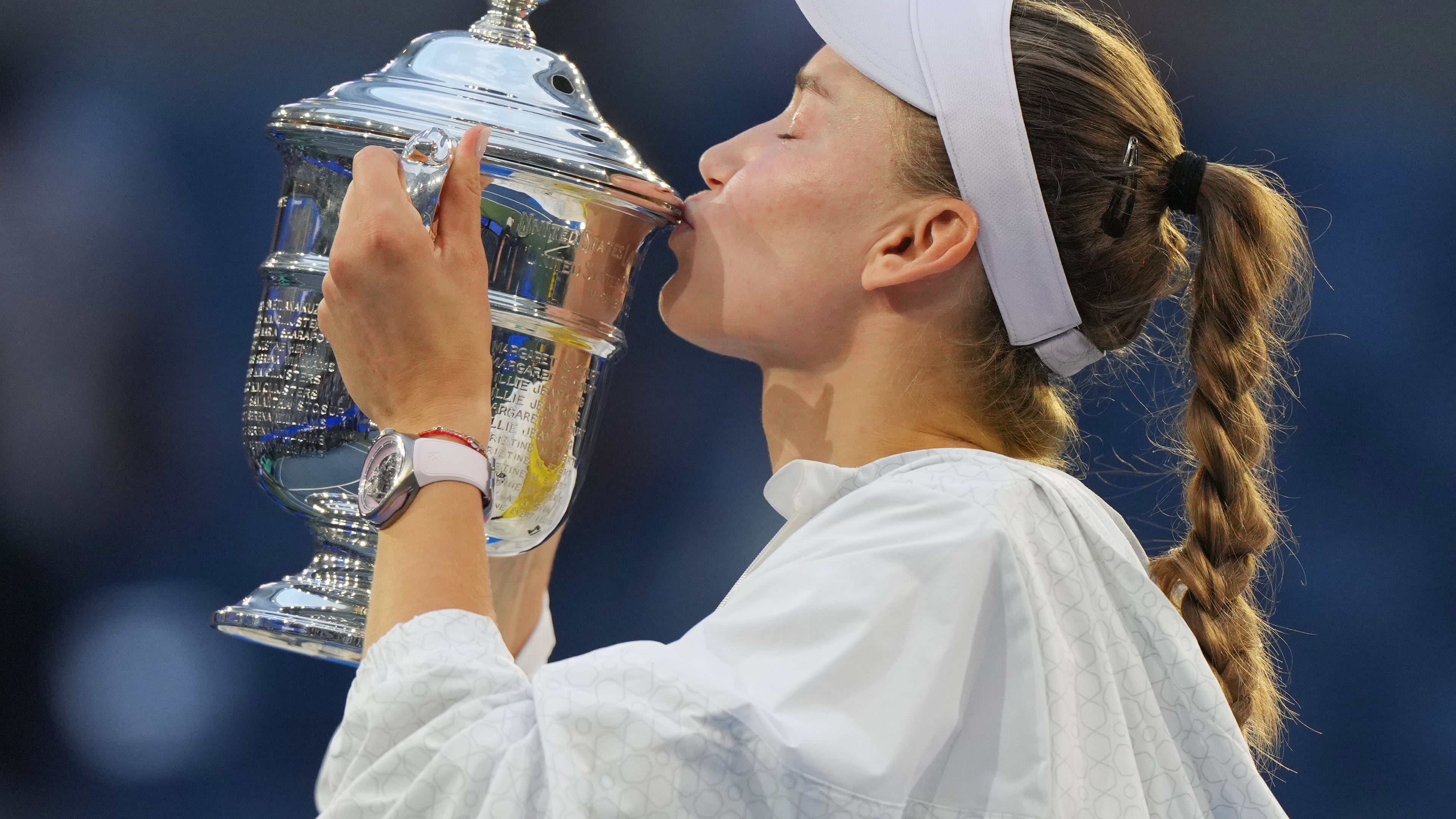 Elena Rybakina, of Kazakhstan, kisses the trophy after she won the women's singles final of the U.S. Open tennis championships against Aryna Sabalenka, of Belarus, Saturday, Sept. 12, 2026, in New York. (AP Photo/Kirsty Wigglesworth)