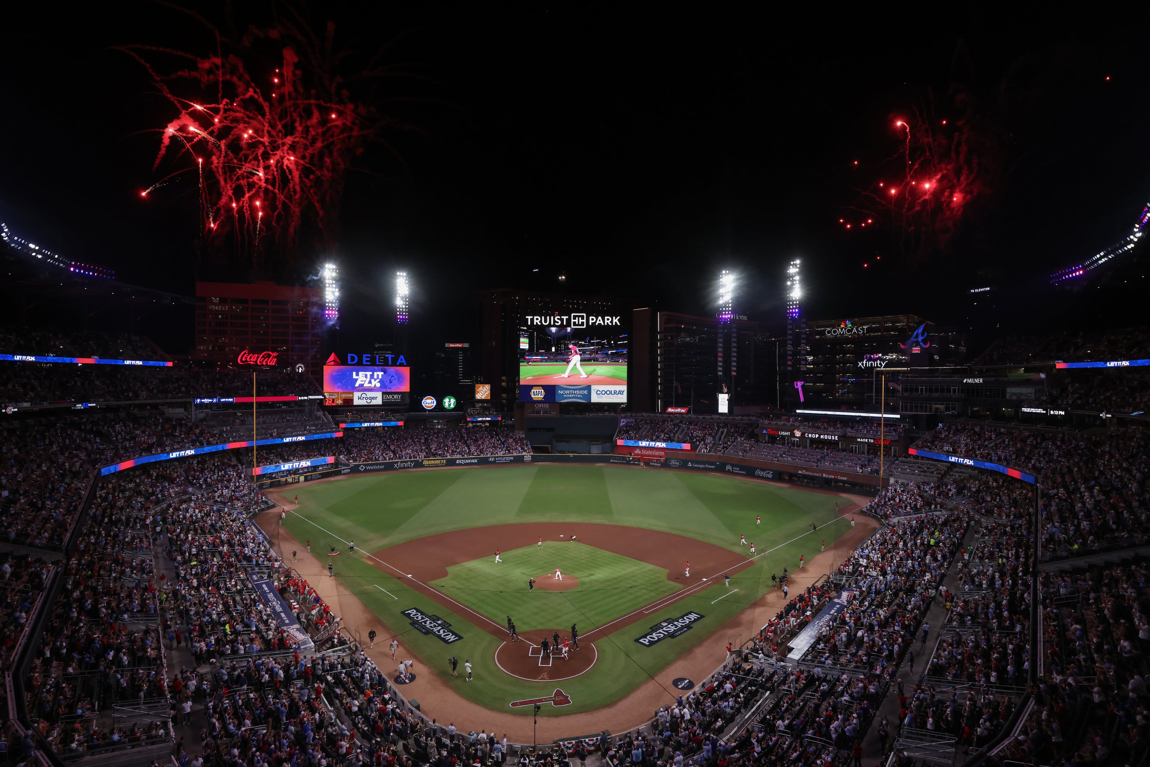 Braves pitcher Ray Kerr takes to the mound as fireworks explode over Truist Park before Game 3 of their NL Wild Card Series against the Philadelphia Phillies on Thursday, Oct. 1, 2026, in Atlanta. (Jason Getz/AJC)