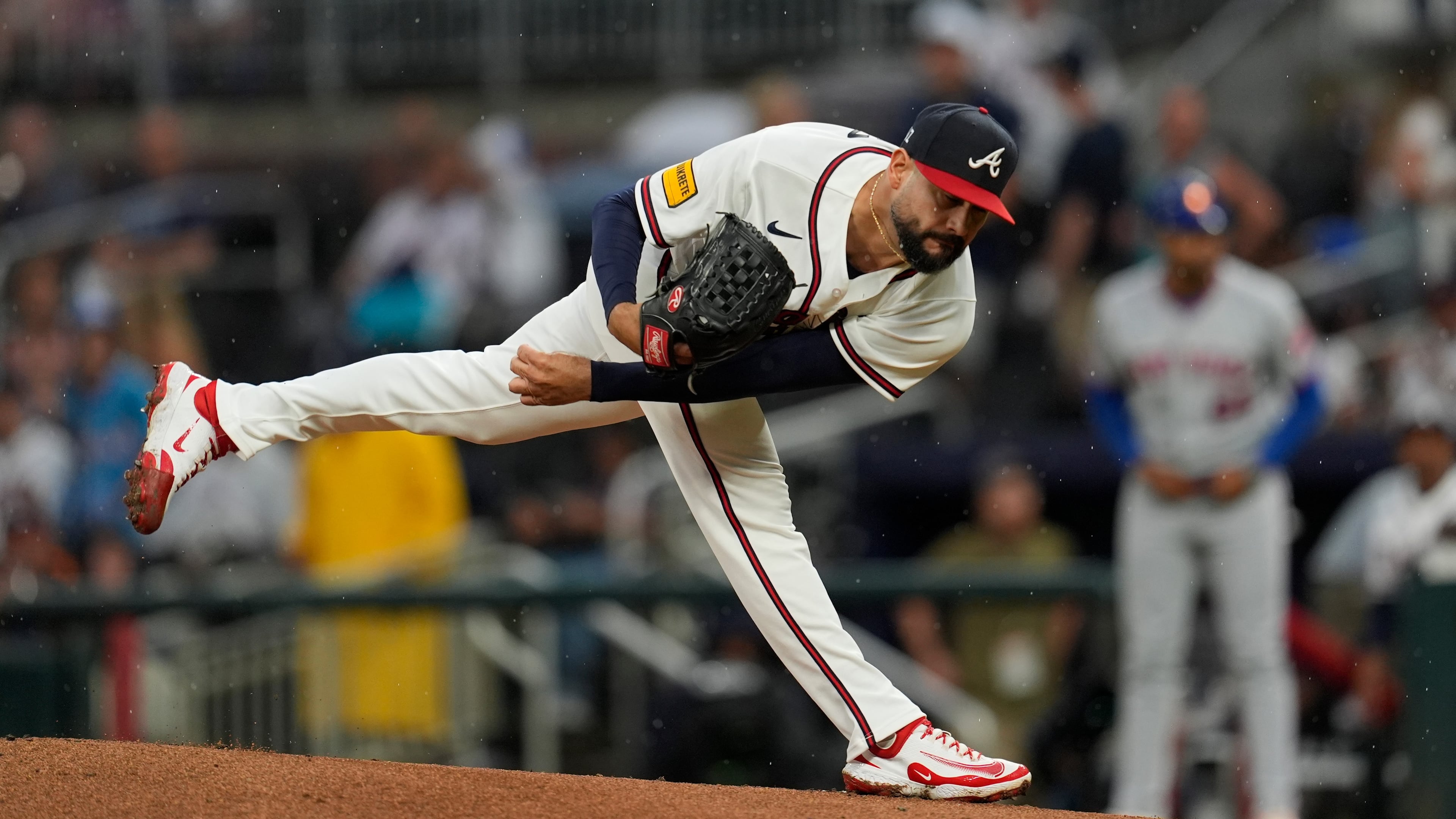 Atlanta Braves pitcher Martín Pérez (33) works against the New York Mets in the first inning of a baseball game, Tuesday, Aug. 11, 2026, in Atlanta. (AP Photo/Mike Stewart)