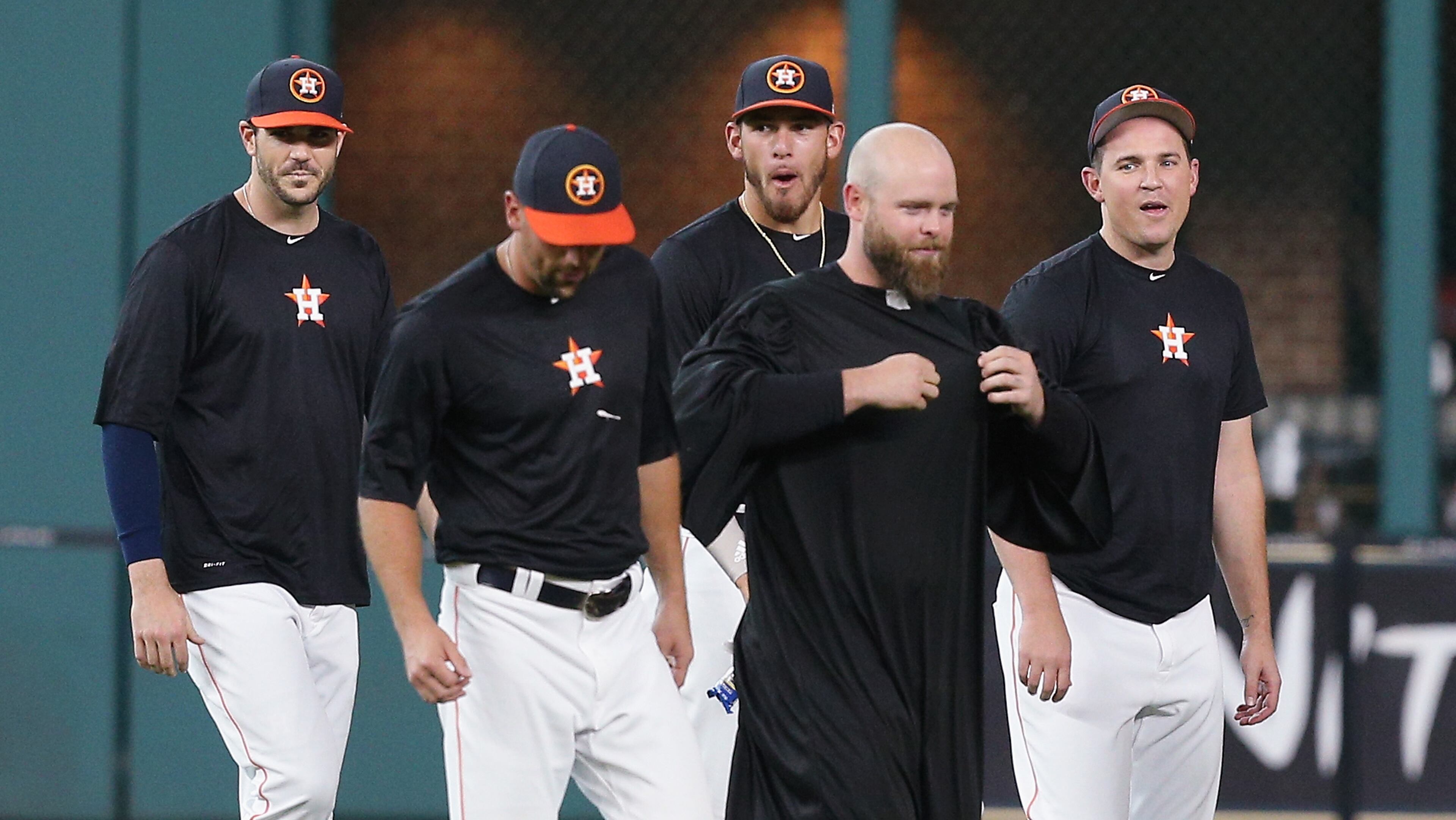 HOUSTON, TX - JULY 17: Brian McCann #16 of the Houston Astros, in robe, leaves center field with Luke Gregerson #44,James Hoyt #51,Joe Musgrove #59 and Will Harris #36 after performing a funeral service for Carlos Beltran's glove in center field at Minute Maid Park on July 17, 2017 in Houston, Texas. Beltran has not played the outfield since May 16 (Photo by Bob Levey/Getty Images)