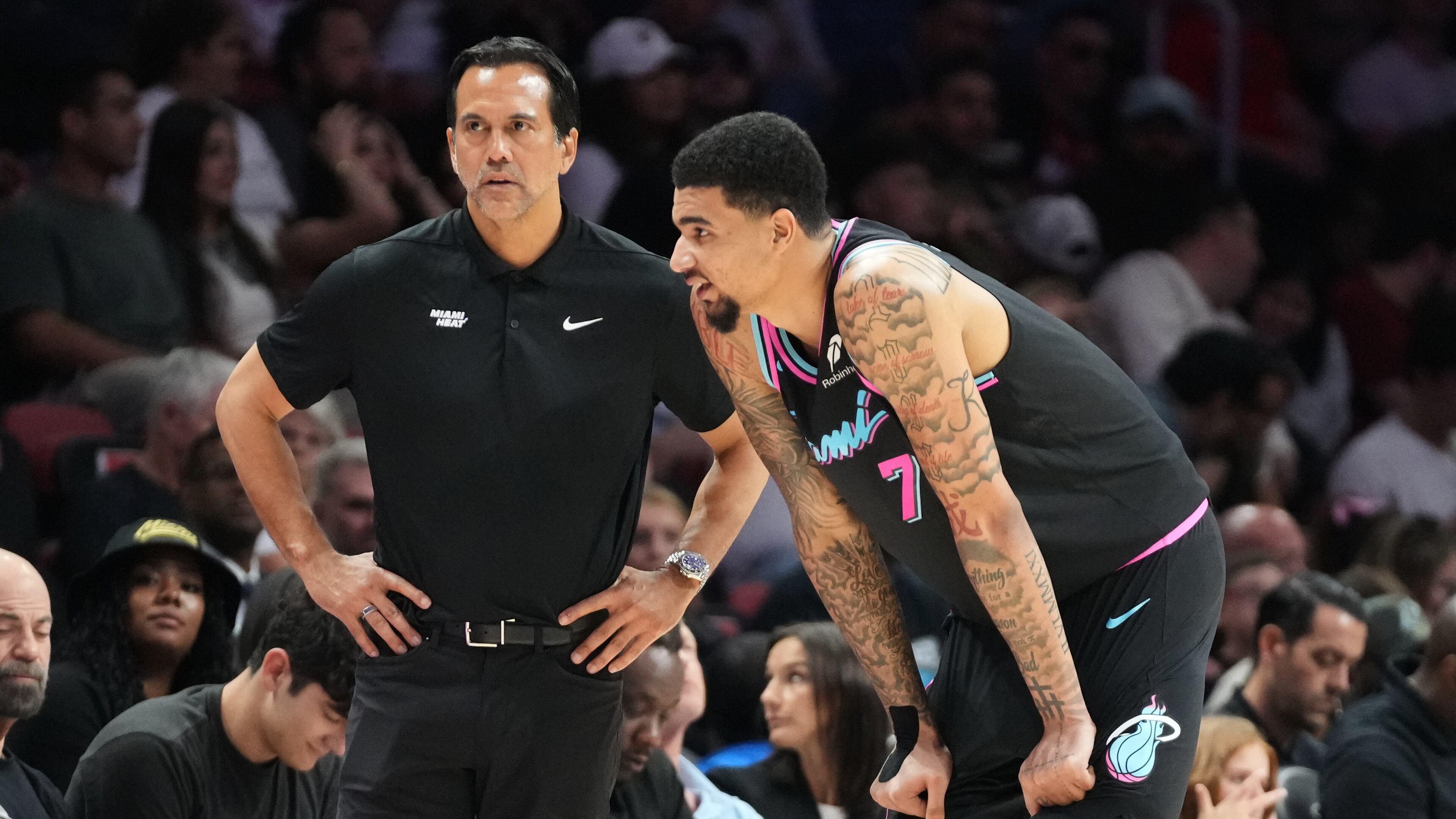 Miami Heat head coach Erik Spoelstra listens to center Kel'el Ware (7) during the second half of an NBA basketball game against the Washington Wizards Saturday, April 4, 2026, in Miami. (AP Photo/Marta Lavandier)