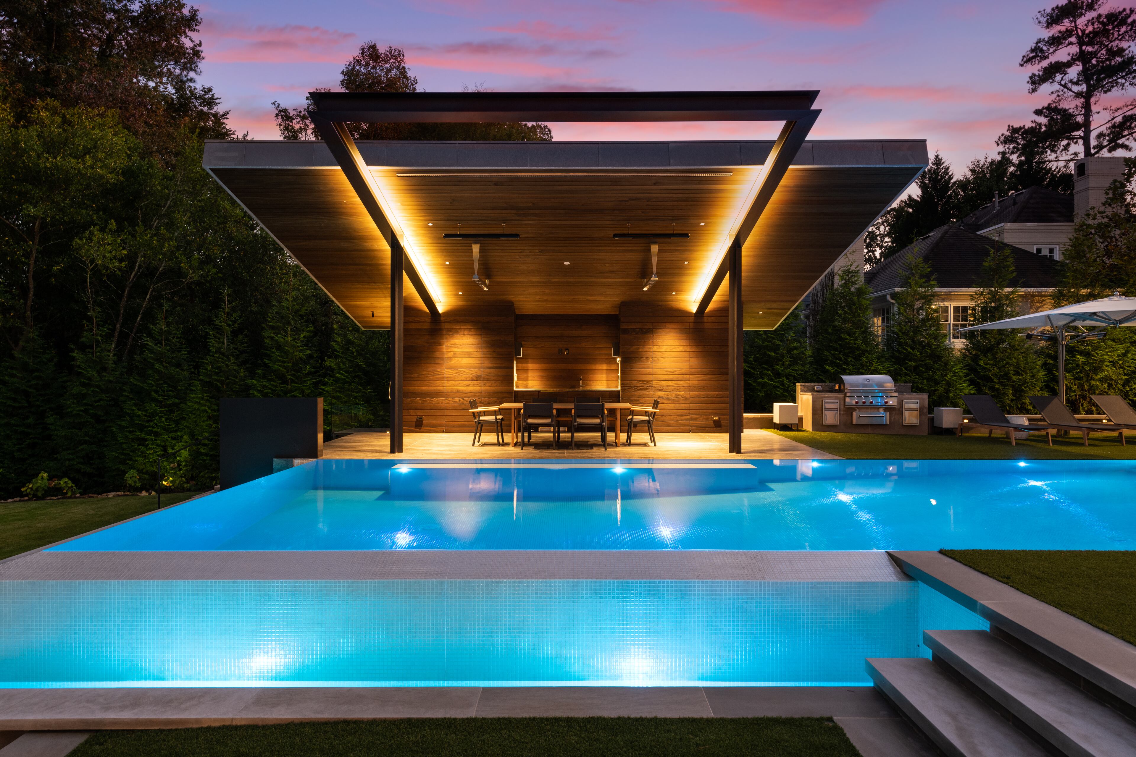 An infinity pool is in the backyard.