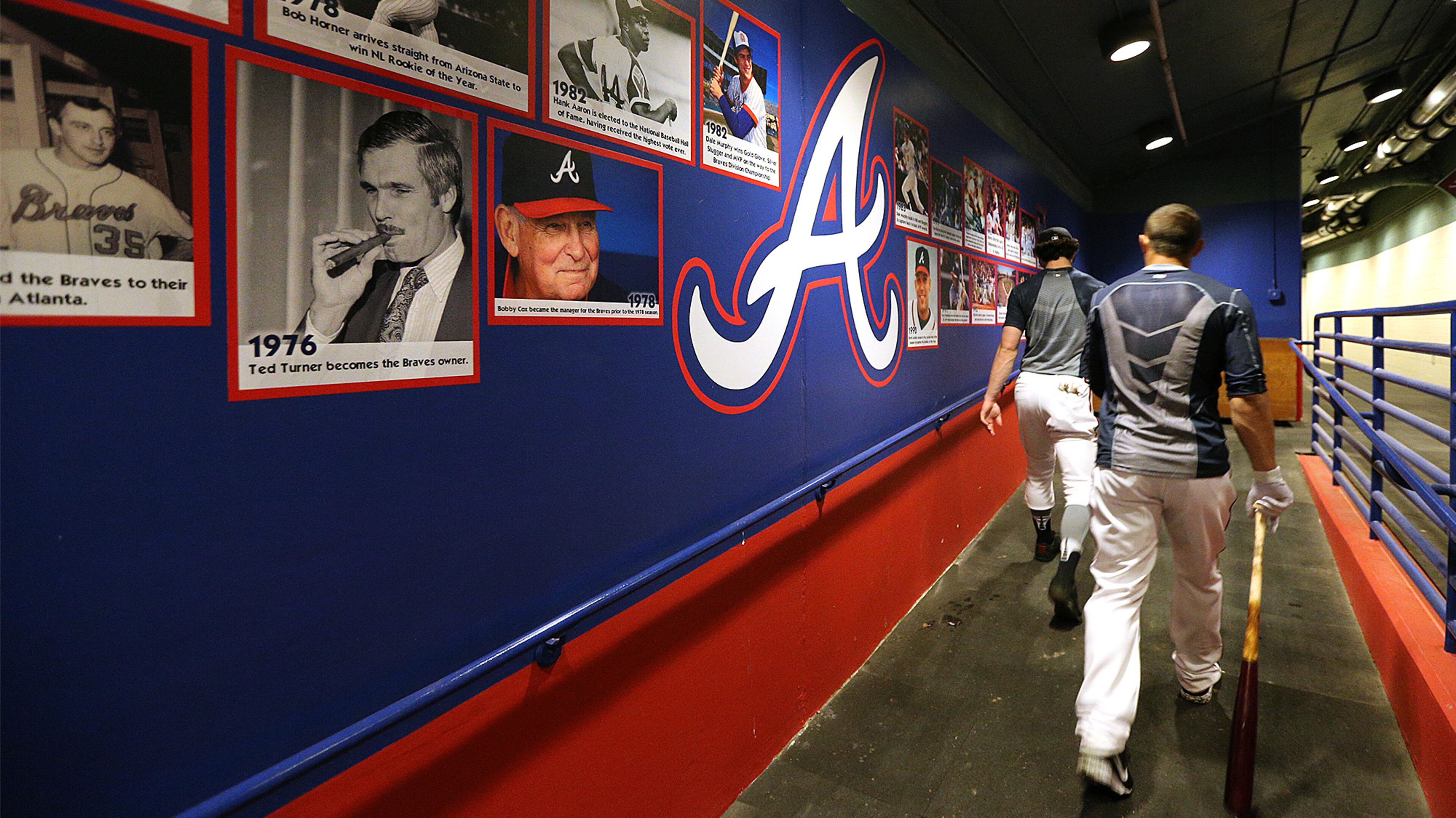 February 21, 2017, Lake Buena Vista, FL: Atlanta Braves Dansby Swanson (left) and Jace Peterson make their way into the clubhouse past a wall of Braves history at spring training in Champion Stadium on Tuesday Feb. 21, 2017, at the ESPN Wide World of Sports in Lake Buena Vista. Curtis Compton/ccompton@ajc.com