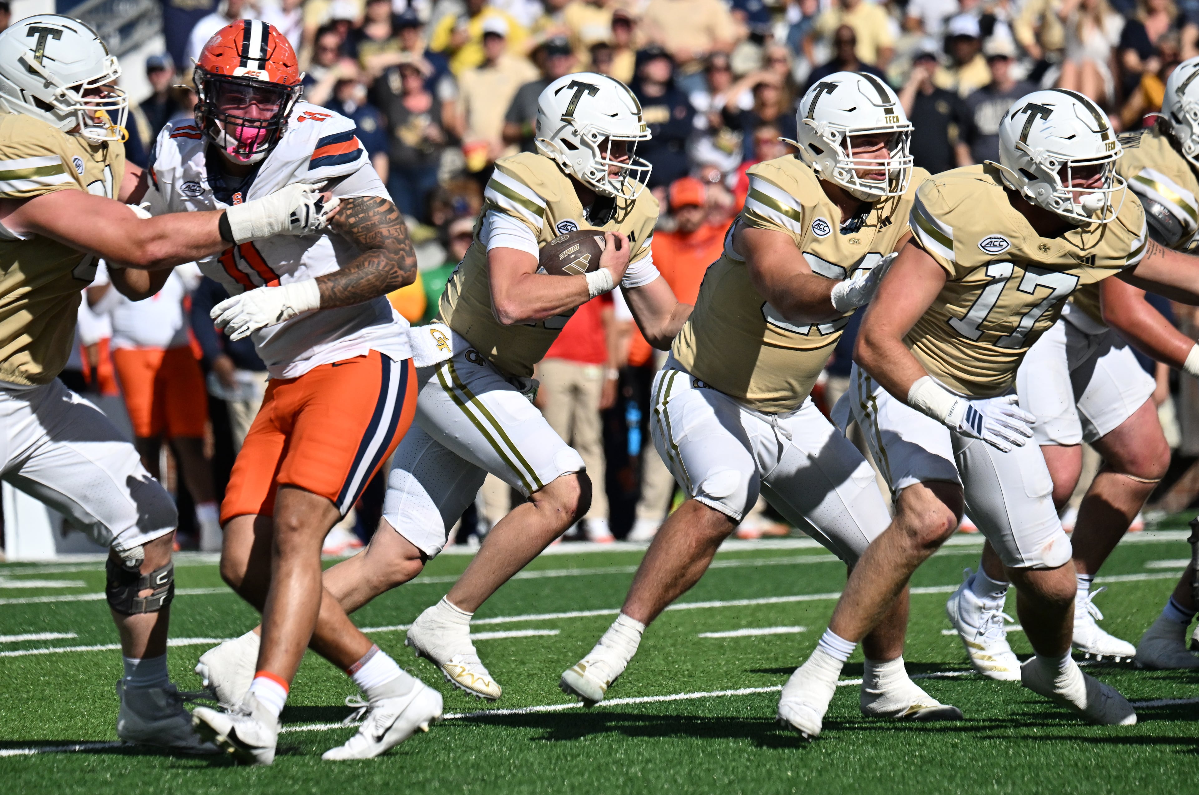 Georgia Tech quarterback Haynes King (third from left) runs for a touchdown during the second half in an NCAA college football game at Bobby Dodd Stadium, Saturday, Oct. 25, 2025 in Atlanta. Georgia Tech won 41-16 over Syracuse. The Yellow Jackets are 8-0 for the first time since 1966 and 5-0 in the ACC for the first time ever. (Hyosub Shin/AJC)