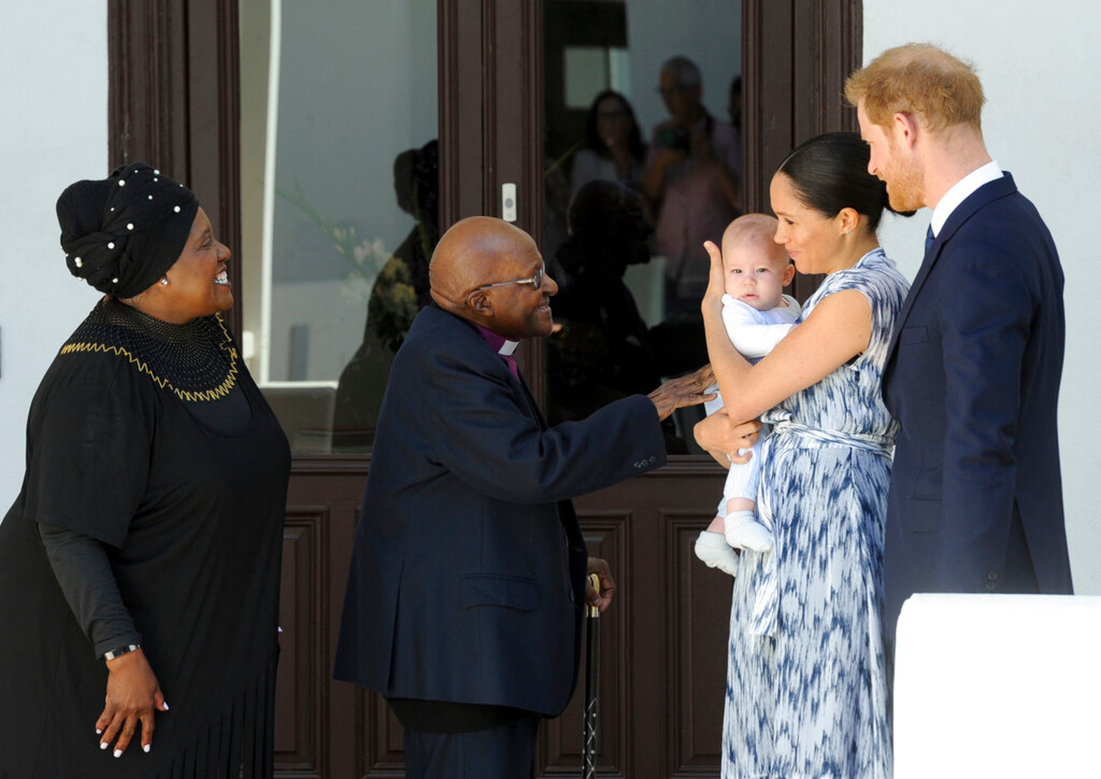 Britain's Prince Harry and Meghan, Duchess of Sussex, holding their son Archie, meet Anglican Archbishop Emeritus, Desmond Tutu and his wife Leah in Cape Town, South Africa,Wednesday, Sept. 25, 2019. The royal couple are on the third day of their African tour. (Henk Kruger/African News Agency via AP, Pool)