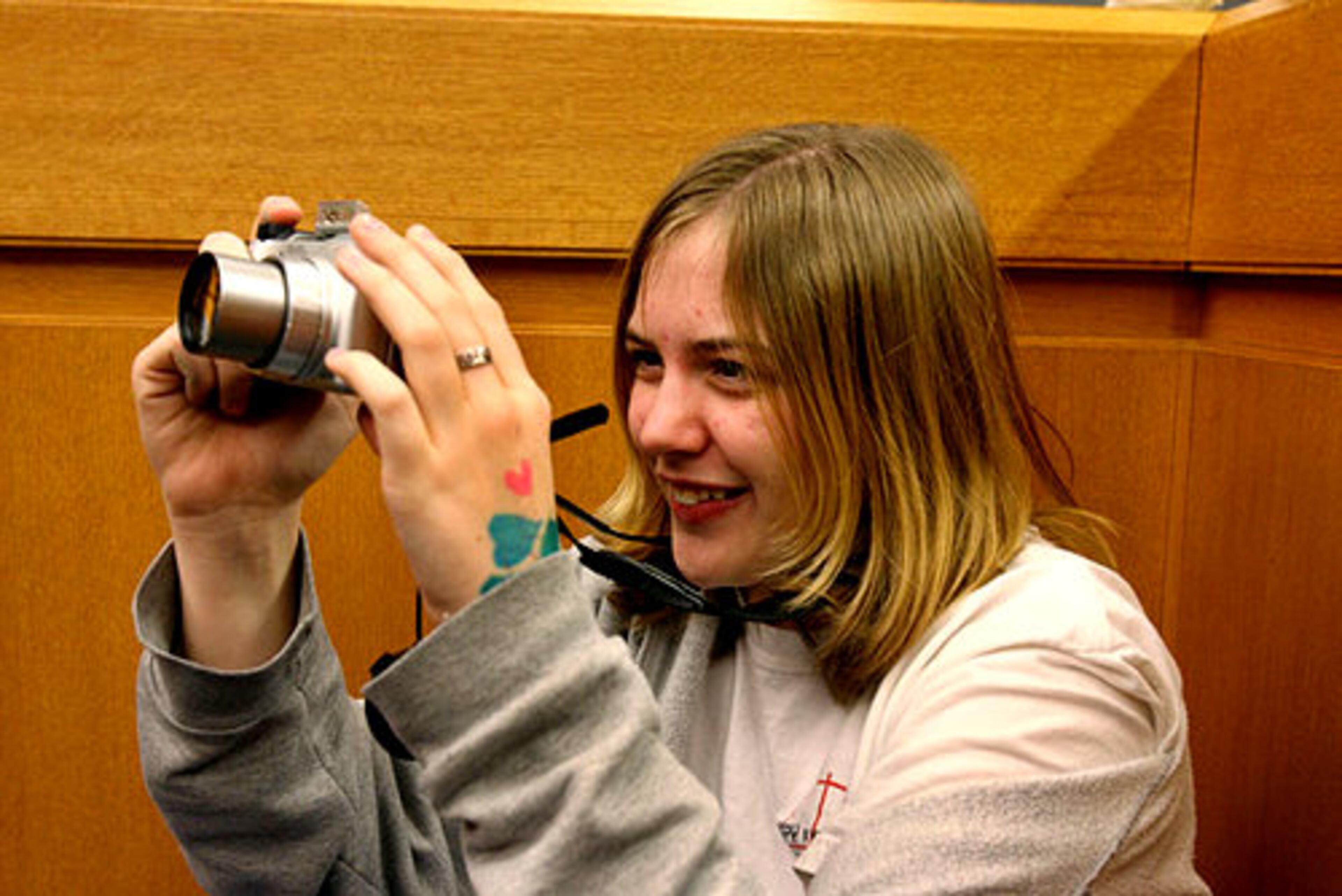 Samantha Myers, 15, serves as photographer for her parents, Craig and Angie Myer, as the Lawrenceville couple renew their wedding vows.