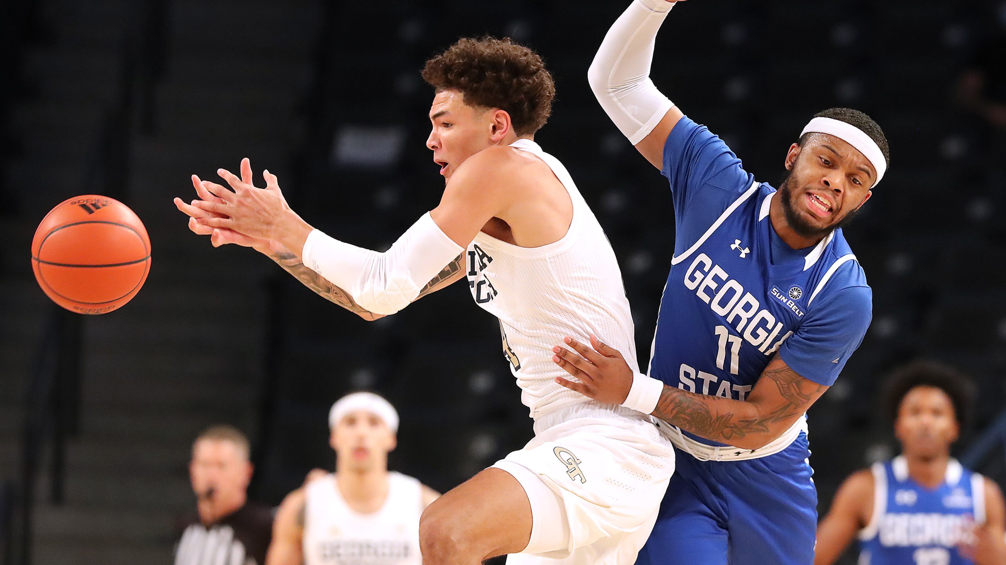 Georgia Tech's Jordan Usher and Georgia State's Corey Allen (11) battle for the ball at McCamish Pavilion in Atlanta on Wednesday, Nov. 25, 2020. (Curtis Compton/Atlanta Journal-Constitution/TNS)