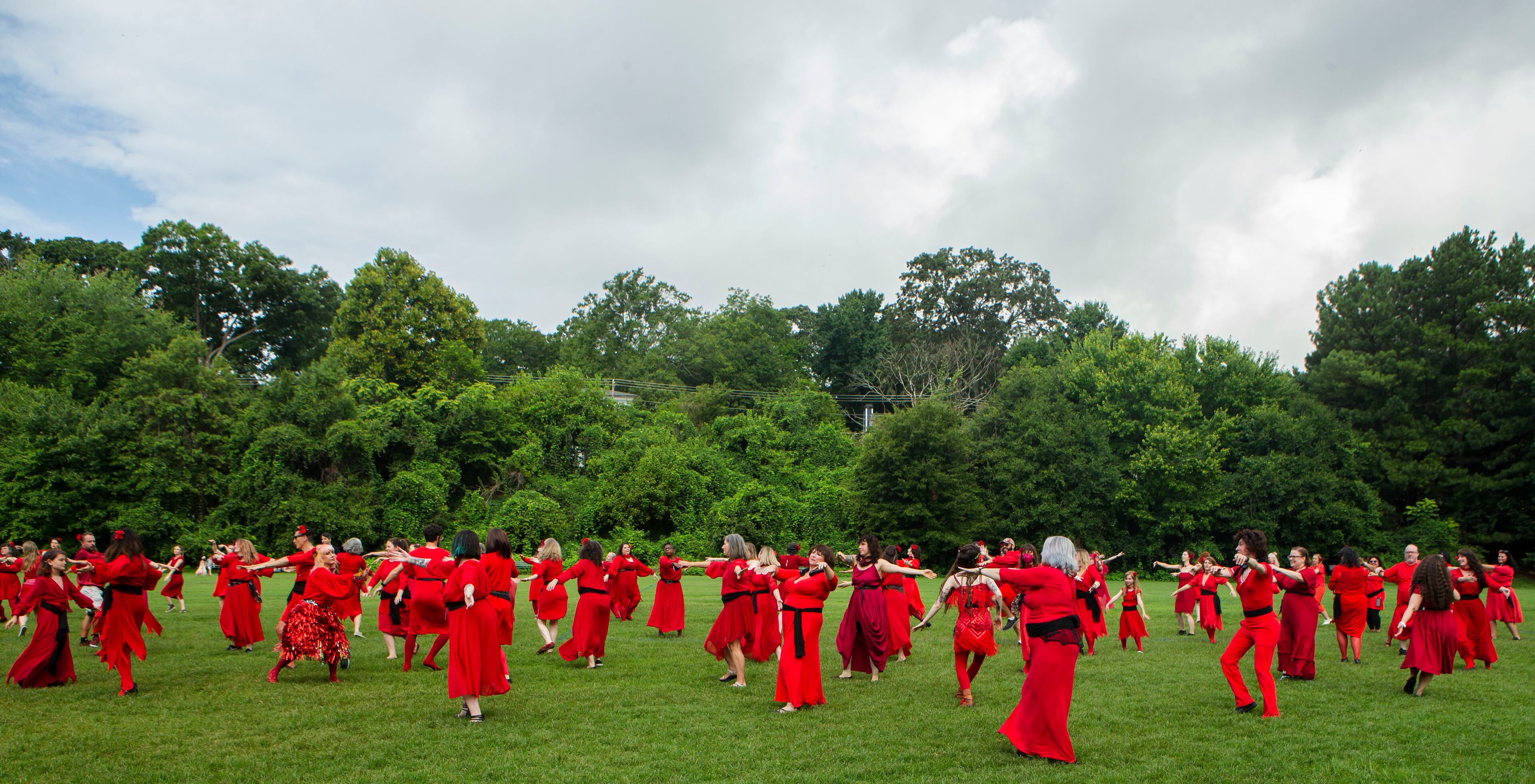 Kate Bush fans dance during a group dance to celebrate the seventh annual international "Most Wuthering Heights Day Ever," on Saturday, July 30, 2022, in Candler Park in Atlanta. The event celebrates Kate Bush's 1978 song "Wuthering Heights" with events in more than 40 cities around the world. CHRISTINA MATACOTTA FOR THE ATLANTA JOURNAL-CONSTITUTION