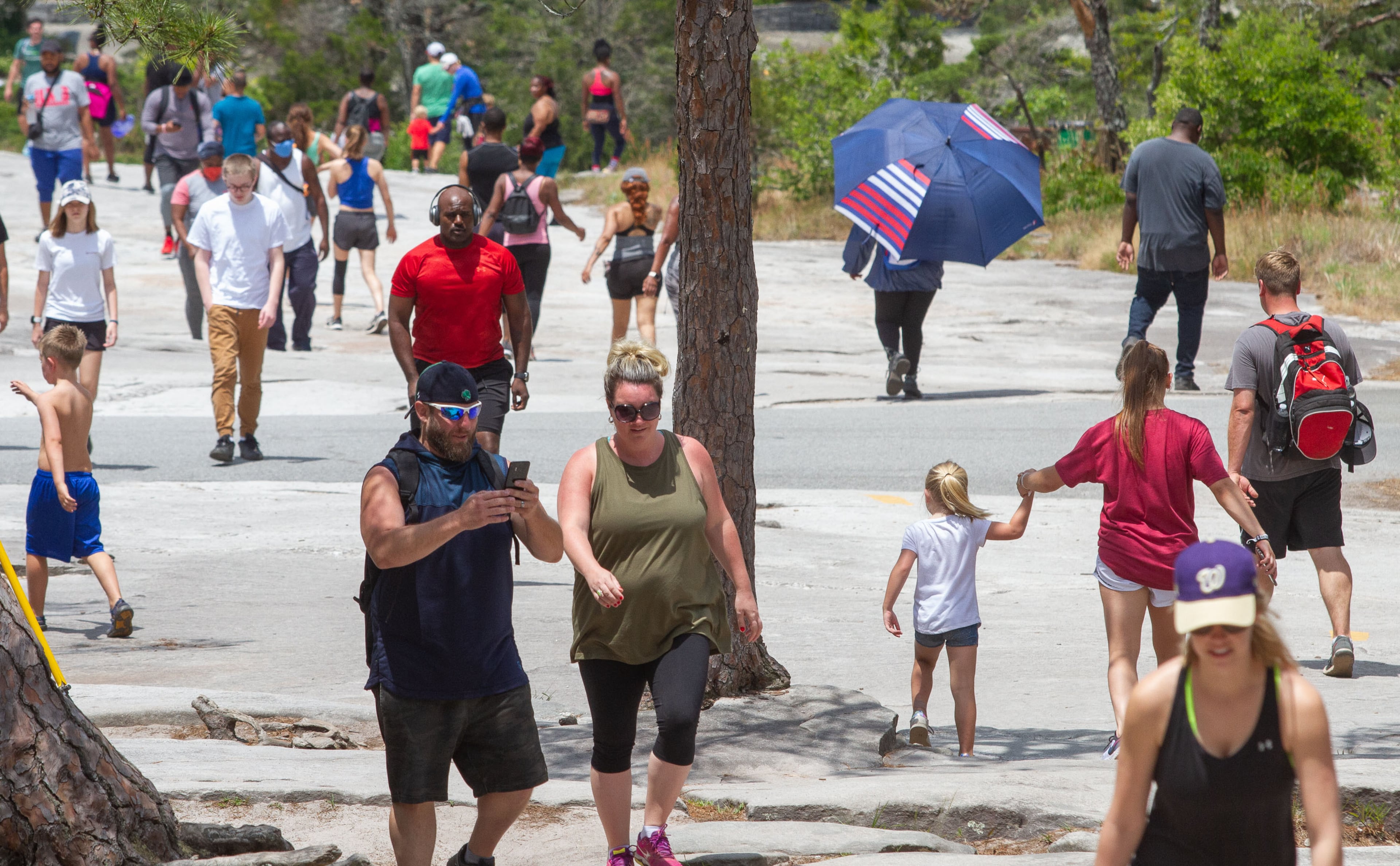 People fill the path that leads up to the top of Stone Mountain on a busy Sunday afternoon on May 17, 2020. STEVE SCHAEFER FOR THE ATLANTA JOURNAL-CONSTITUTION