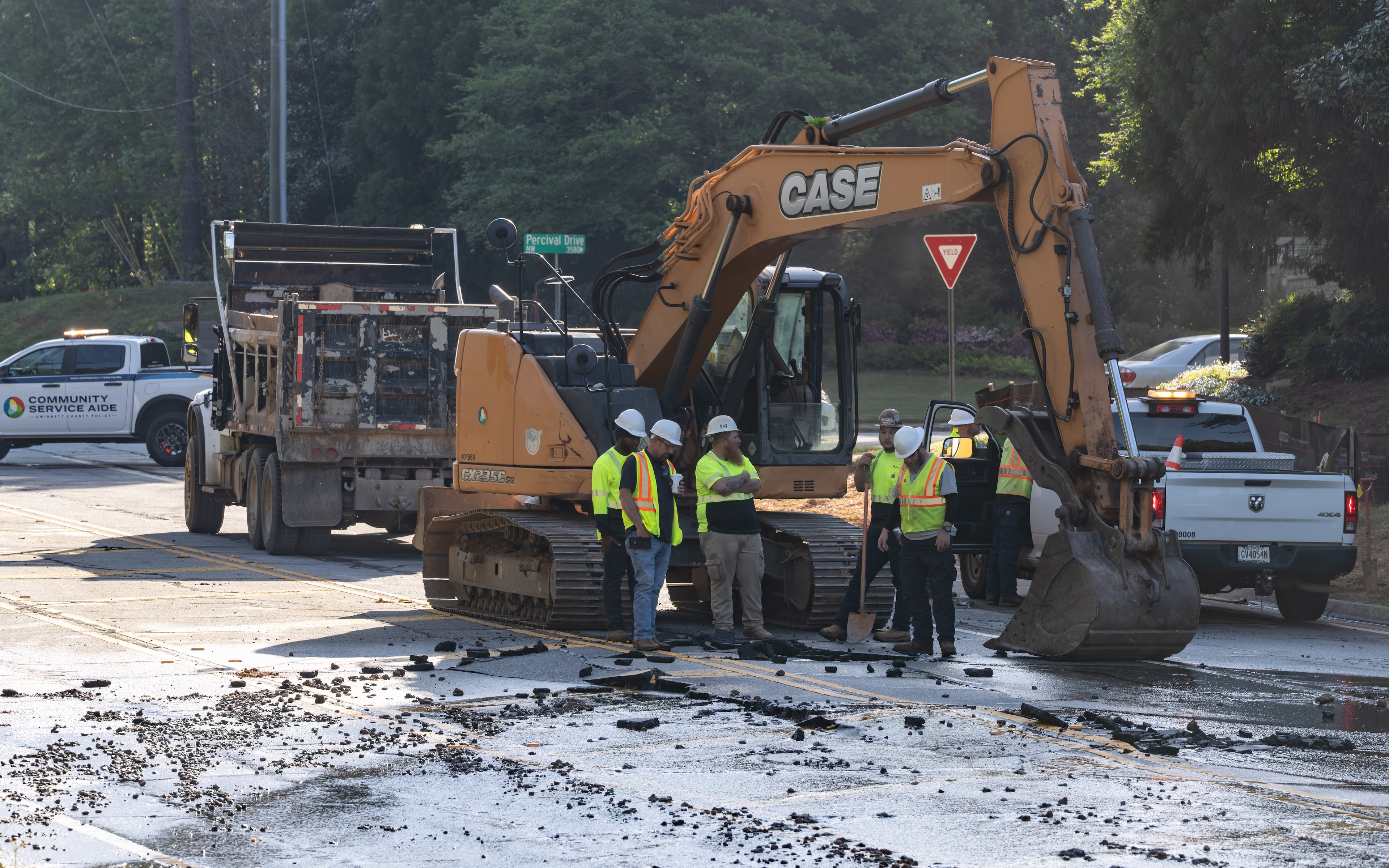 Crews work to repair a water main on Buford Highway on Tuesday, April 14, 2026, near Duluth. (Ben Hendren for the AJC)