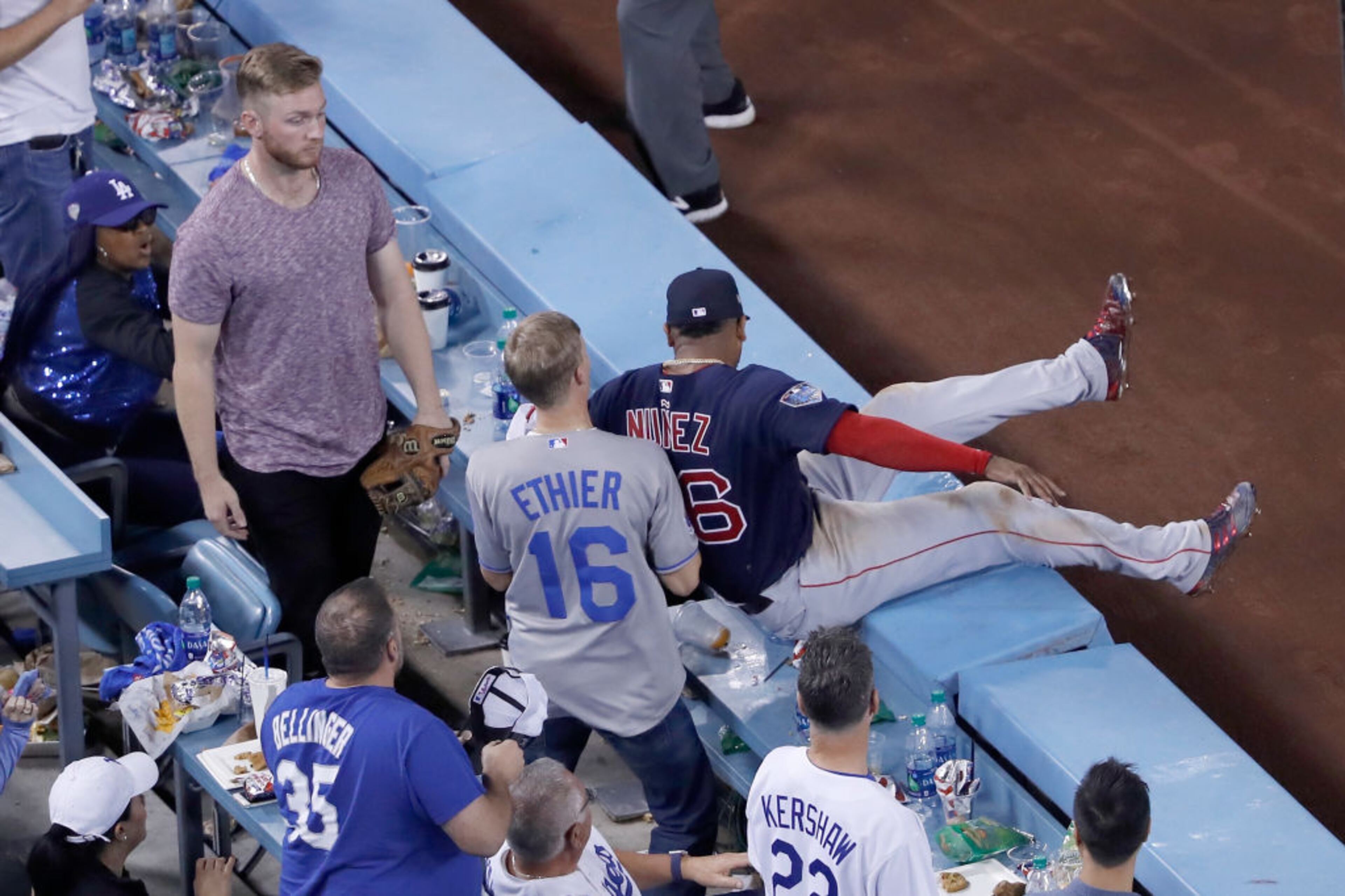 LOS ANGELES, CA - OCTOBER 26: Eduardo Nunez #36 of the Boston Red Sox falls into the stands after catching a ball in foul territory for the second out of the thirteenth inning against the Los Angeles Dodgers in Game Three of the 2018 World Series at Dodger Stadium on October 26, 2018 in Los Angeles, California. (Photo by Sean M. Haffey/Getty Images)