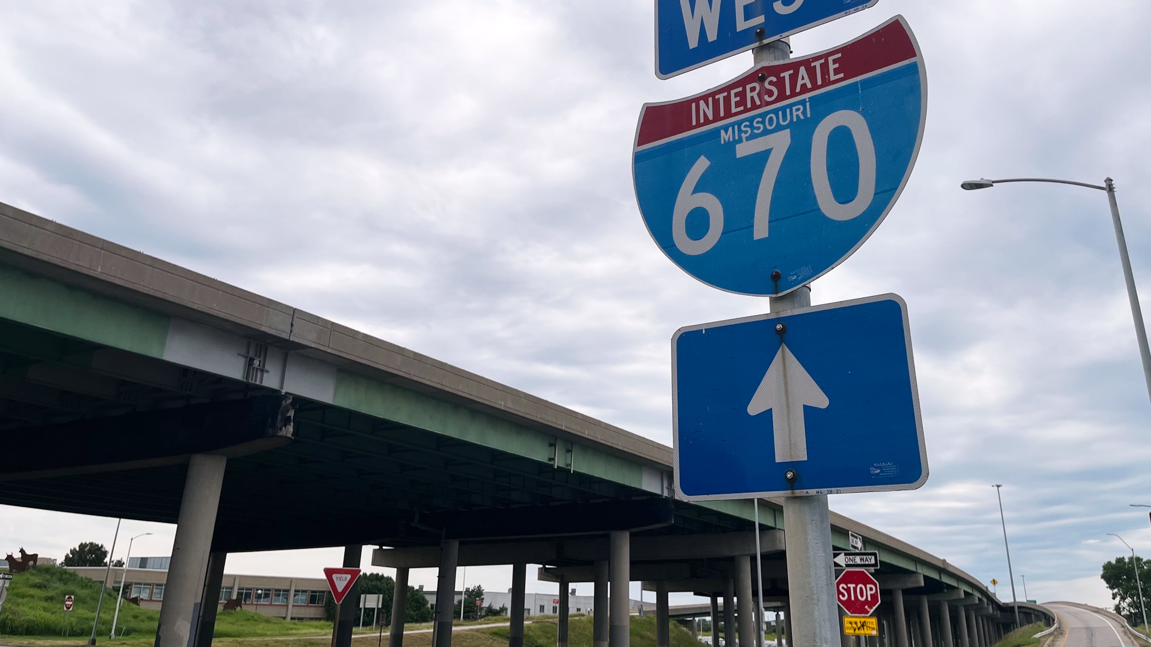 A sign for I-670 is seen near the site of a shooting Thursday, June 18, 2026, in Kansas City, Mo. (AP Photo/Heather Hollingsworth)