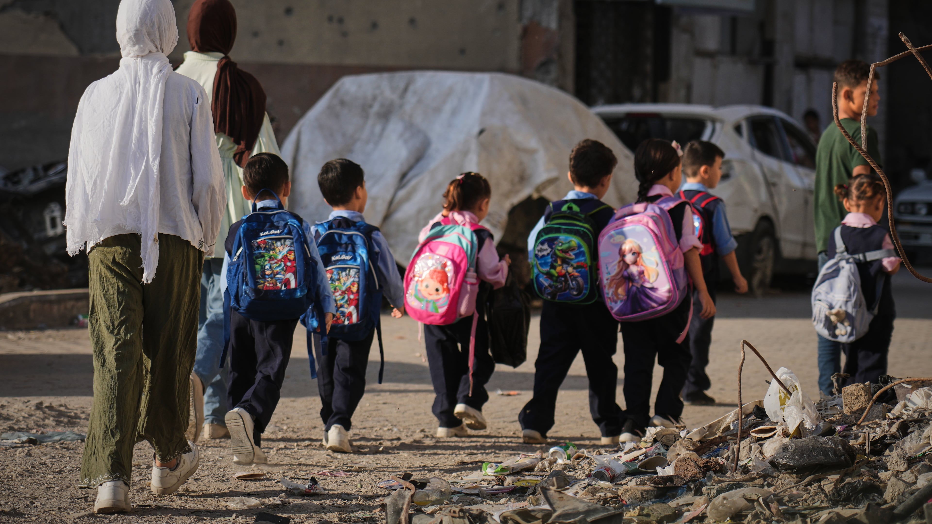 Young Palestinian students make their way to school in Gaza City, Monday, Sept. 28, 2026. (AP Photo/Jehad Alshrafi)