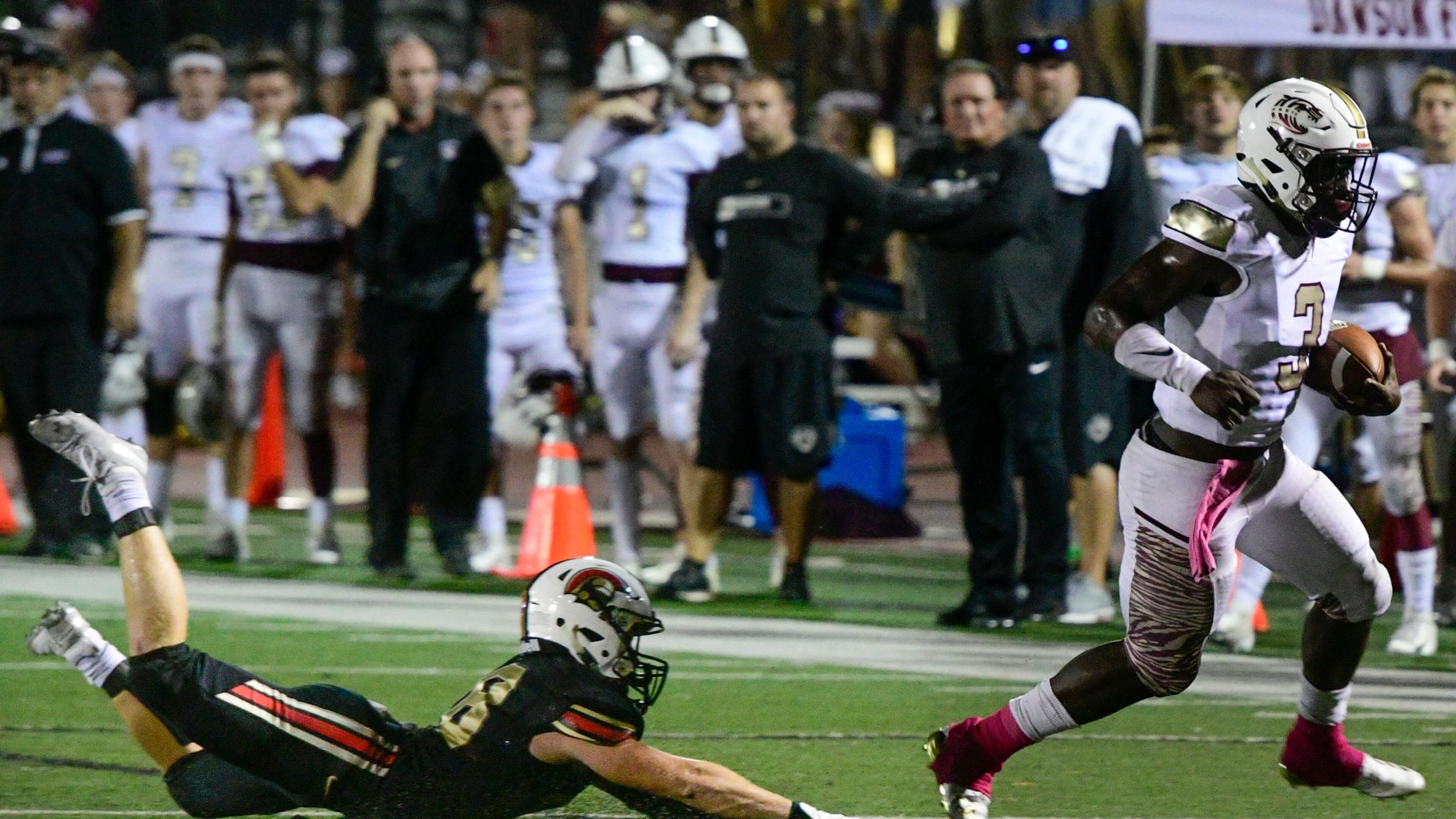 GAC CB Sam Collins is left in the turf as Dawson Sevaughn Clark makes a touchdown run during a high school football game Friday, Oct.5, 2018, in Norcross. John Amis/Special
