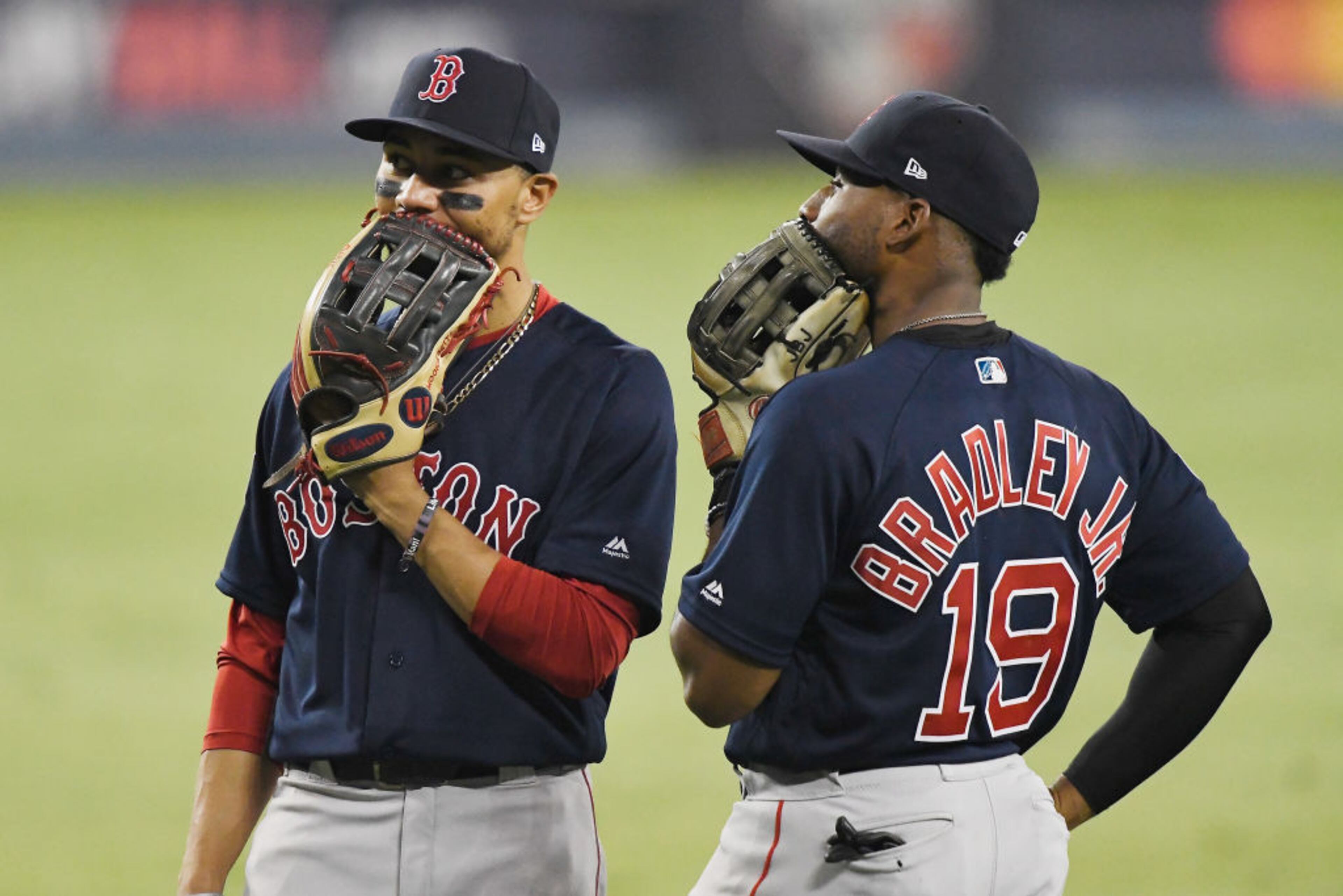 LOS ANGELES, CA - OCTOBER 26: Mookie Betts #50 of the Boston Red Sox and Jackie Bradley Jr. #19 talk during the thirteenth inning against the Los Angeles Dodgers in Game Three of the 2018 World Series at Dodger Stadium on October 26, 2018 in Los Angeles, California. (Photo by Kevork Djansezian/Getty Images)
