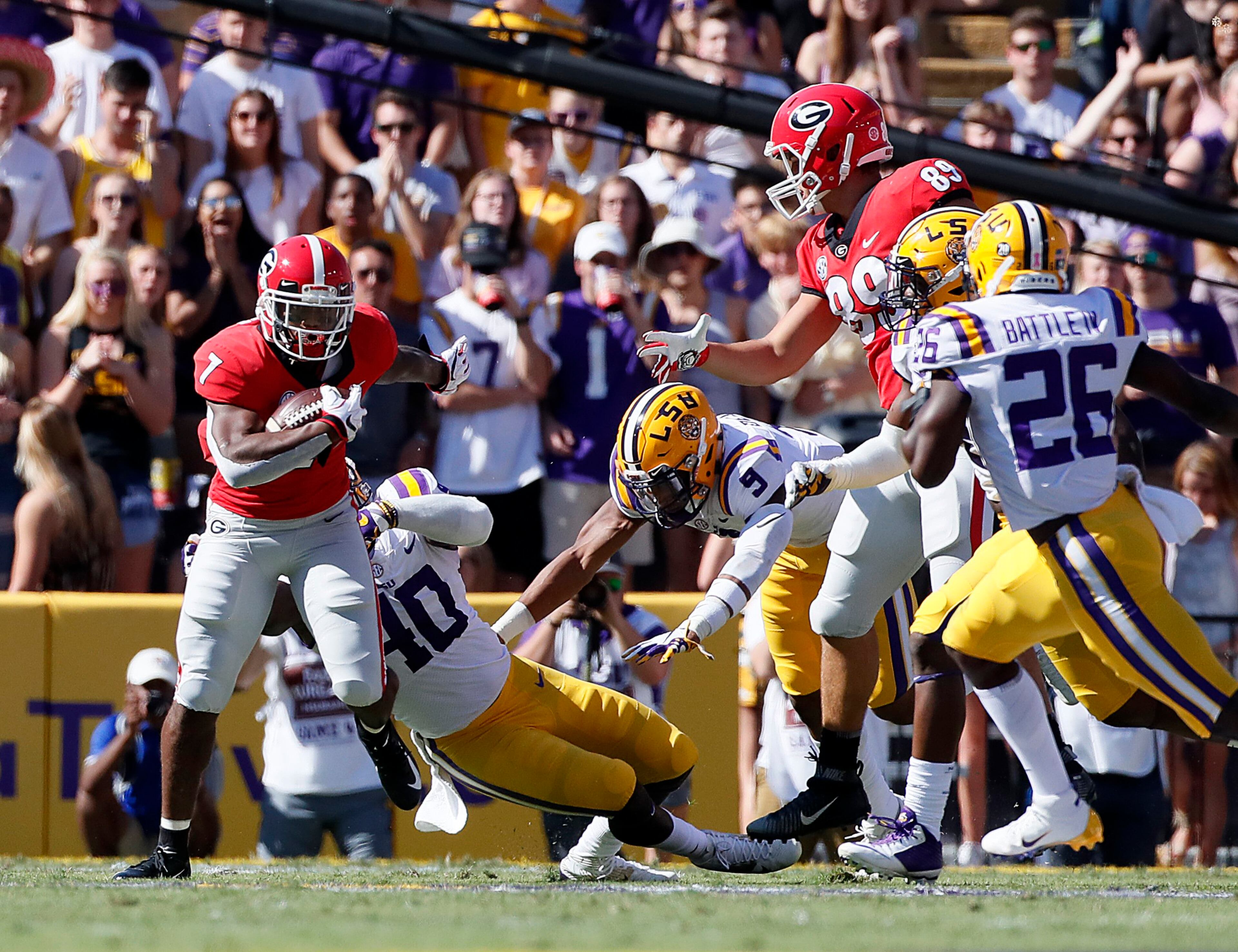 10/13/18 - Baton Rouge - Georgia Bulldogs running back D'Andre Swift (7) breaks away for some big yardage in the first quarter. The University of Georgia Bulldogs played the Louisiana State University Tigers in a NCAA college football game Saturday, October 13, 2018, at Tiger Stadium in Baton Rouge, LA. BOB ANDRES / BANDRES@AJC.COM