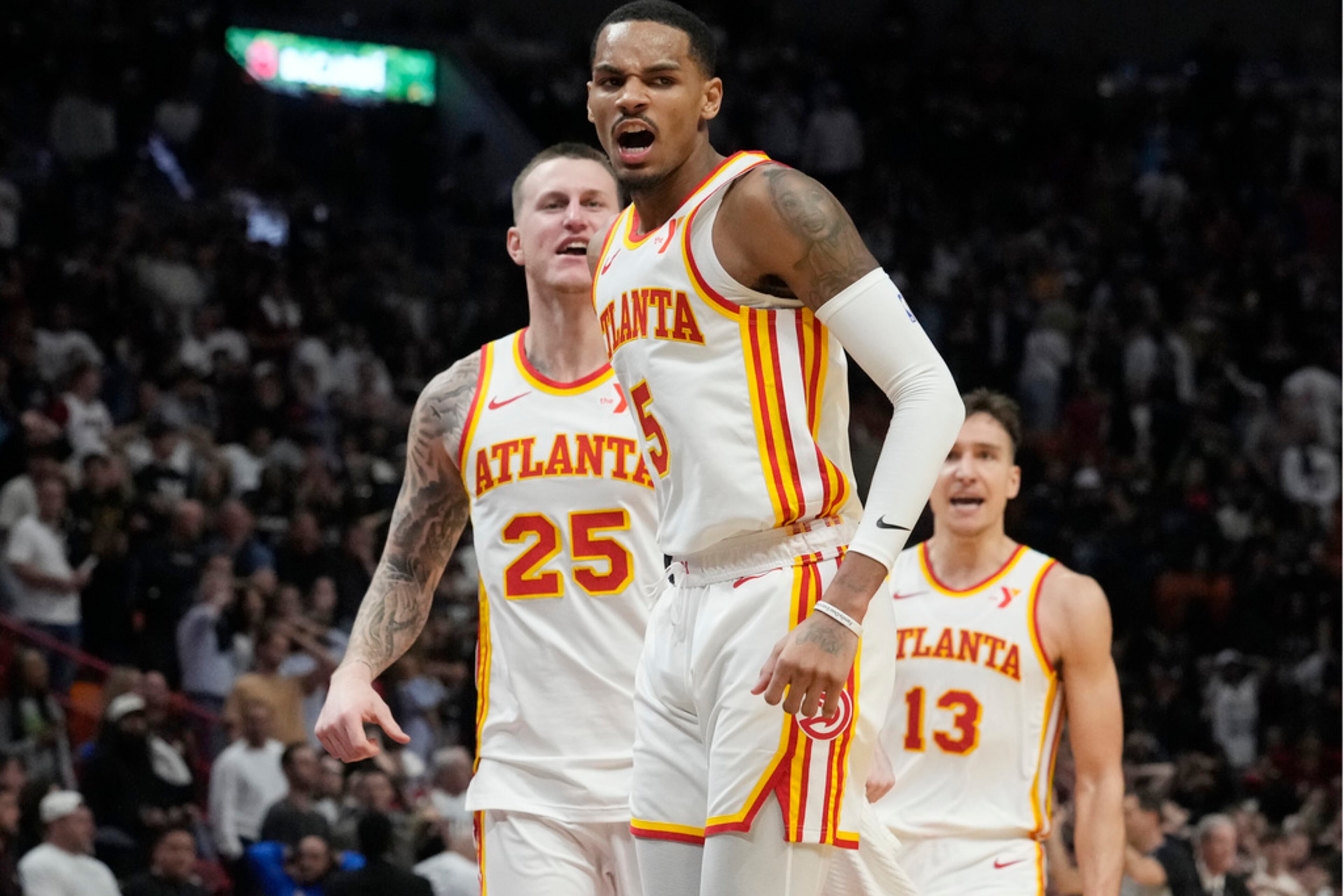 Atlanta Hawks guard Dejounte Murray (5) reacts after scoring the game winning basket during the second half of an NBA basketball game against the Miami Heat, Friday, Jan. 19, 2024, in Miami. (AP Photo/Marta Lavandier)