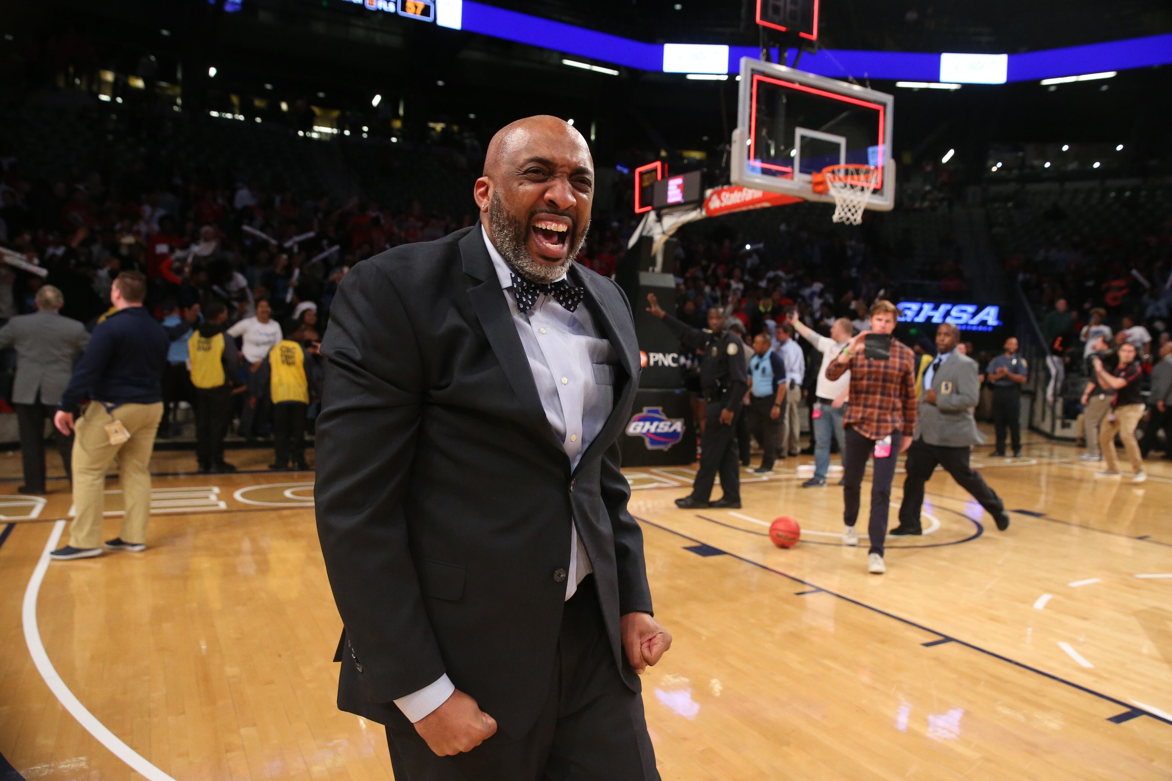 March 9, 2018 - Atlanta, Ga: Lovejoy coach Cedric King celebrates their win against Harrison during the GHSA Class AAAAAA Girls State Championship at McCamish Pavilion Friday, March 9, 2018, in Atlanta. Lovejoy won 57-41. PHOTO / JASON GETZ