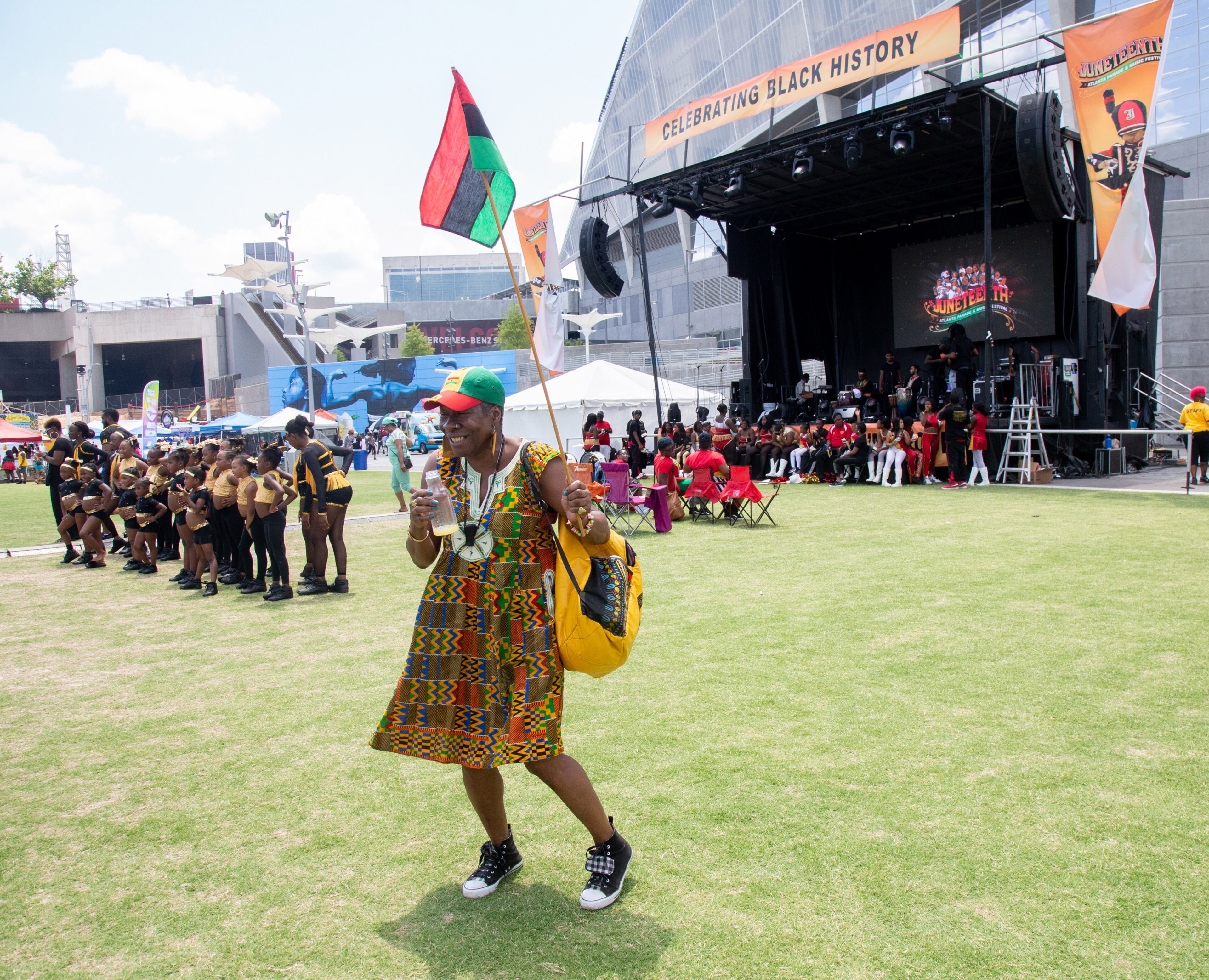 Sharon Ann Smith dances to the music at the Home Depot Backyard at the end of the Juneteenth Atlanta Black History Parade on Saturday, June 15, 2019. STEVE SCHAEFER / SPECIAL TO THE AJC