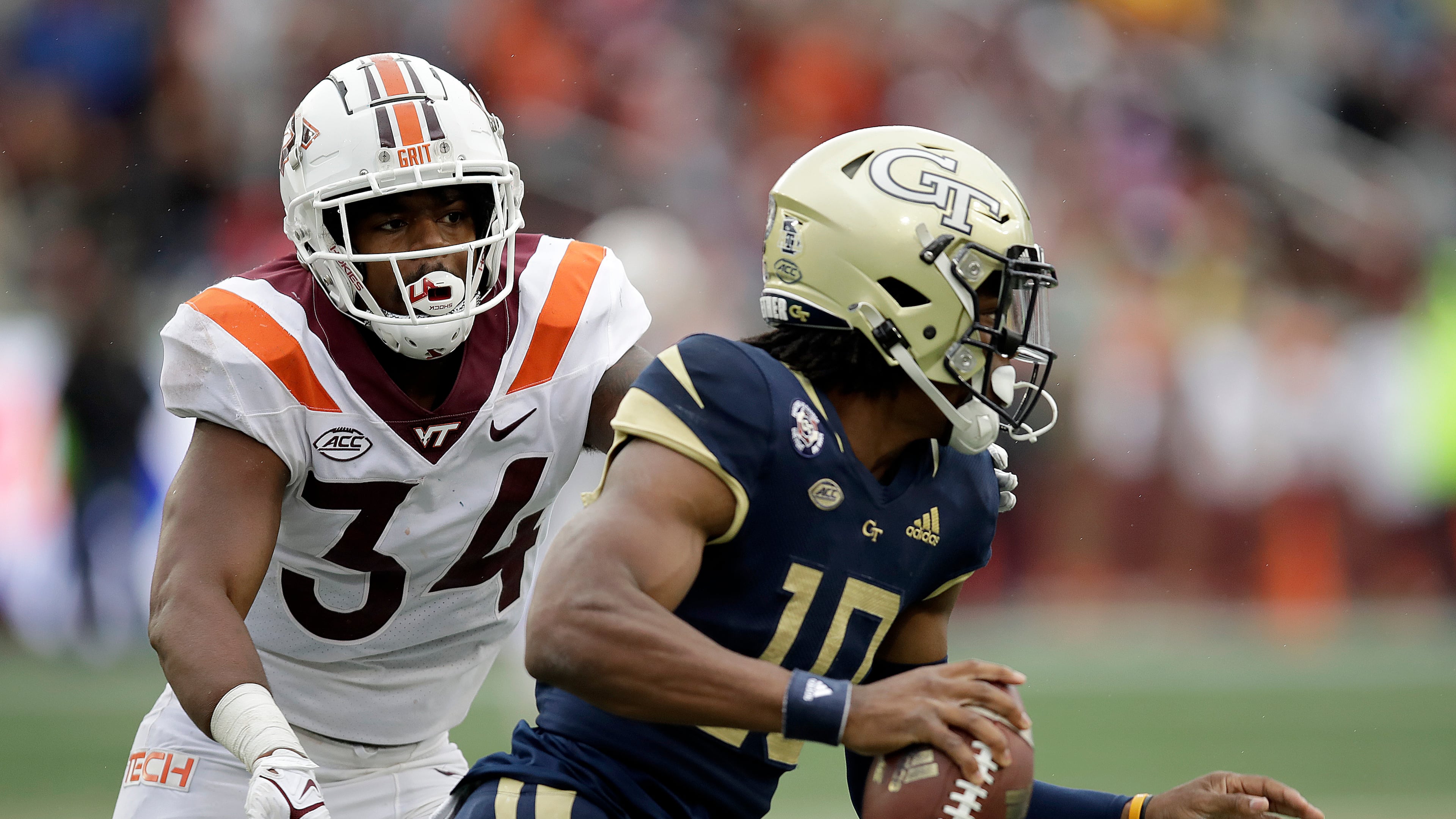Virginia Tech linebacker Alan Tisdale pressures Georgia Tech quarterback Jeff Sims during the second half Oct. 30, 2021, in Atlanta. (AP Photo/Ben Margot)