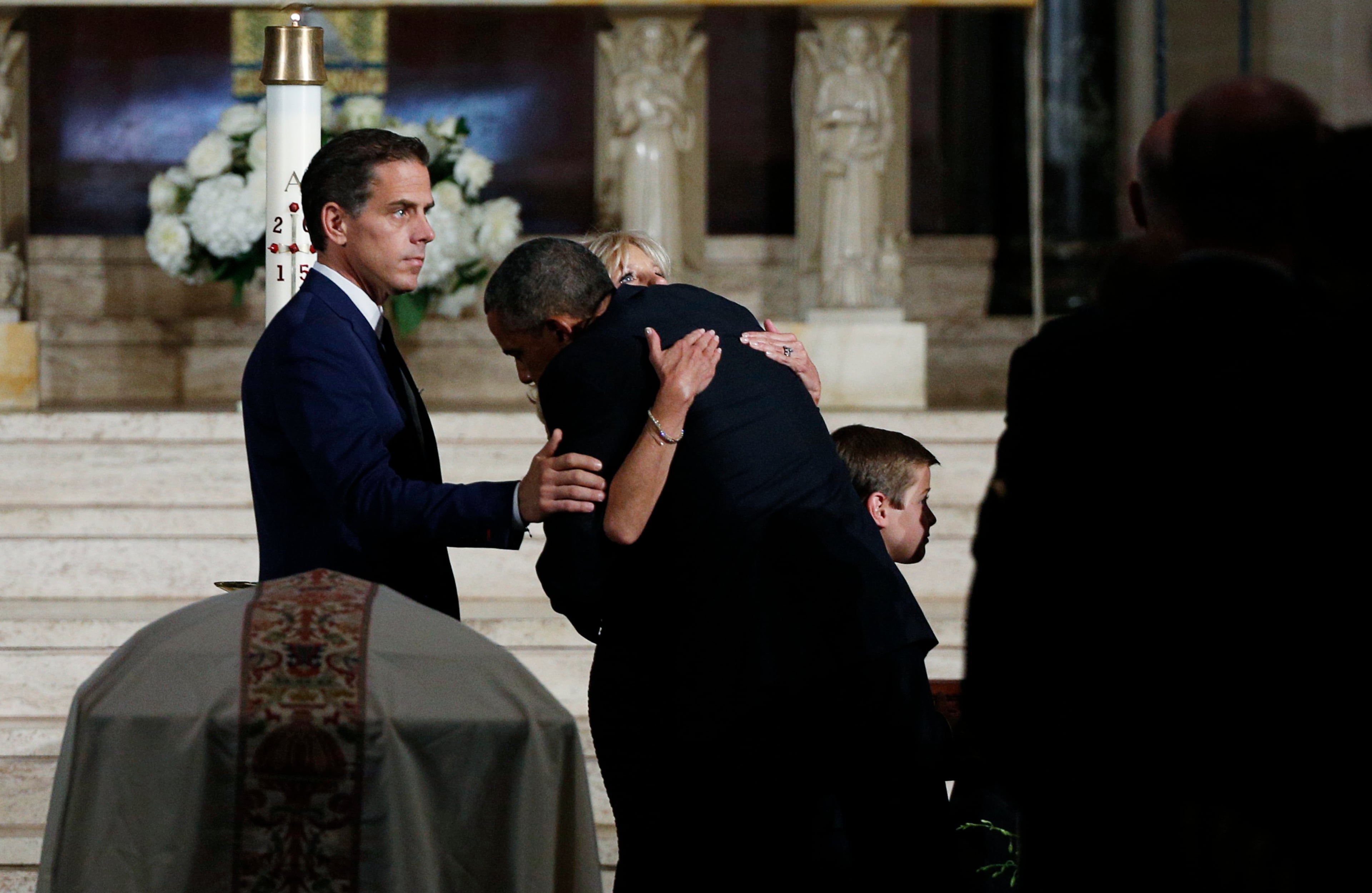 President Barack Obama hugs Jill Biden during funeral services for Vice President Joe Biden's son, former Delaware Attorney General Beau Biden, Saturday, June 6, 2015, at St. Anthony of Padua Church in Wilmington, Del. (Kevin Lamarque/Pool Photo via AP)