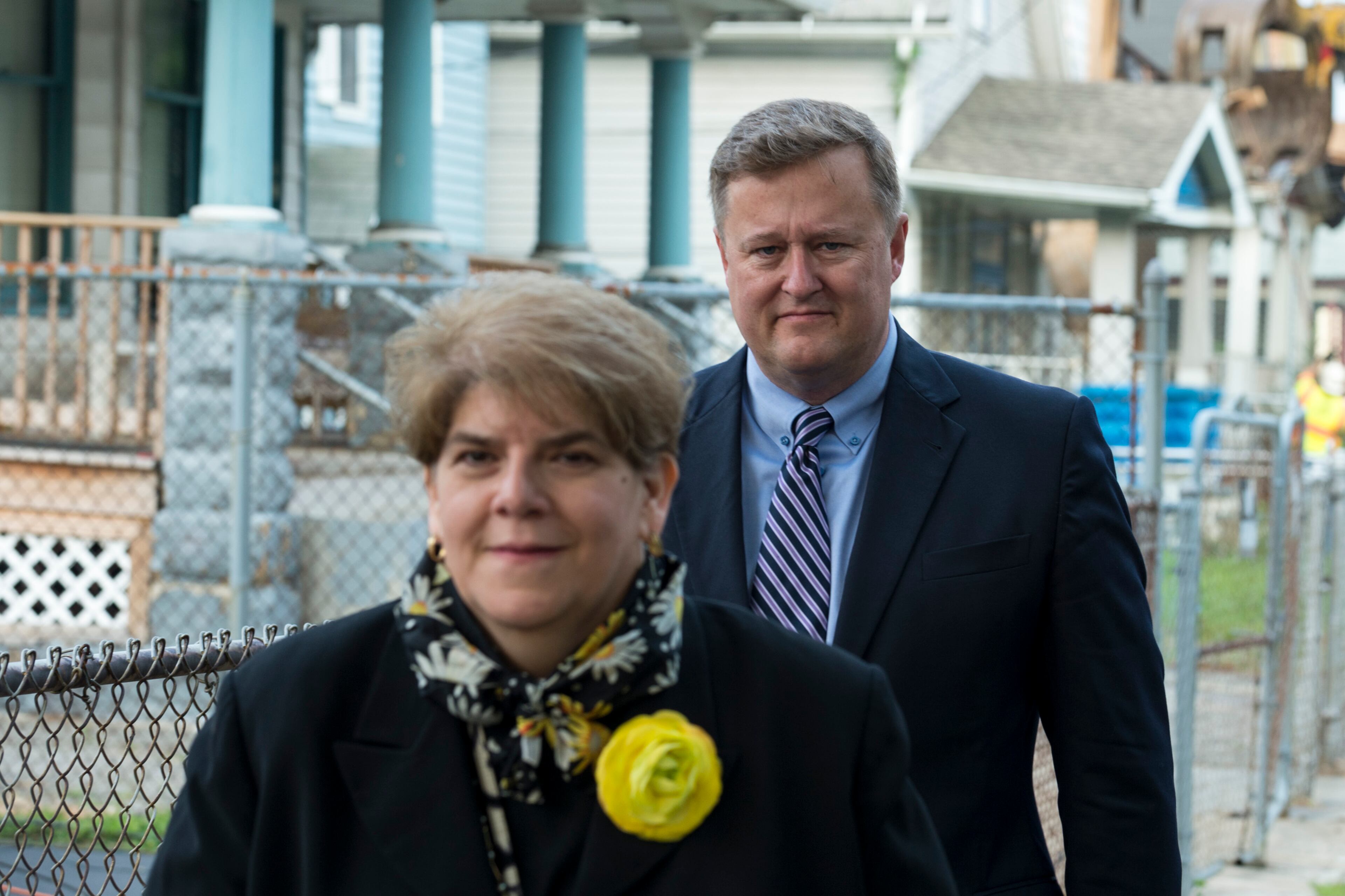 Assistant County Prosecutor Blaise Thomas leaves after viewing the demolition of Ariel Castro's home on August 7, 2013 in Cleveland, Ohio.