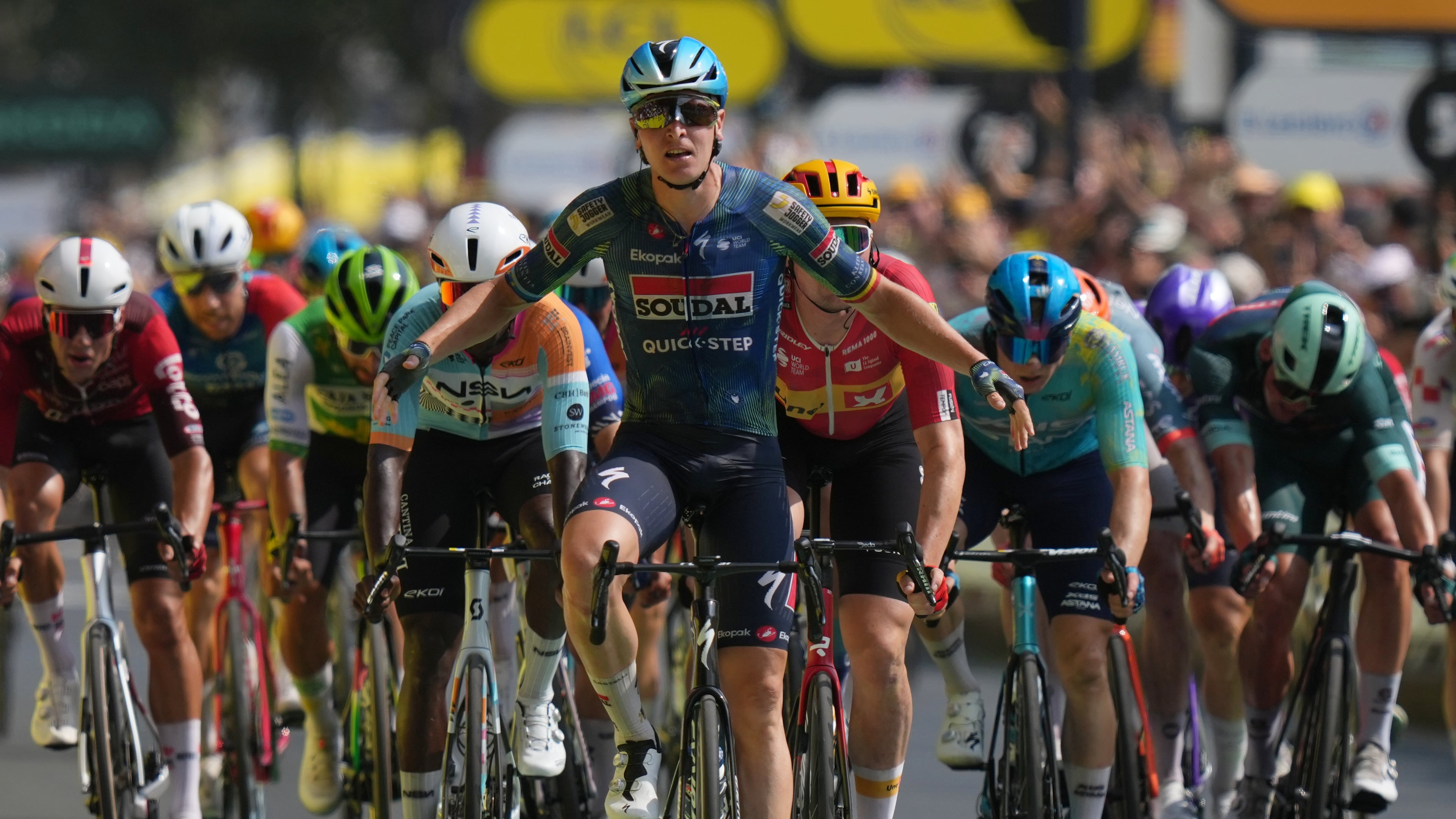 Belgium's Tim Merlier celebrates as he crosses the finish line to win the seventh stage of the Tour de France cycling race with start in Hagetmau and finish in Bordeaux, France, Friday, July 10, 2026. (AP Photo/Thibault Camus)