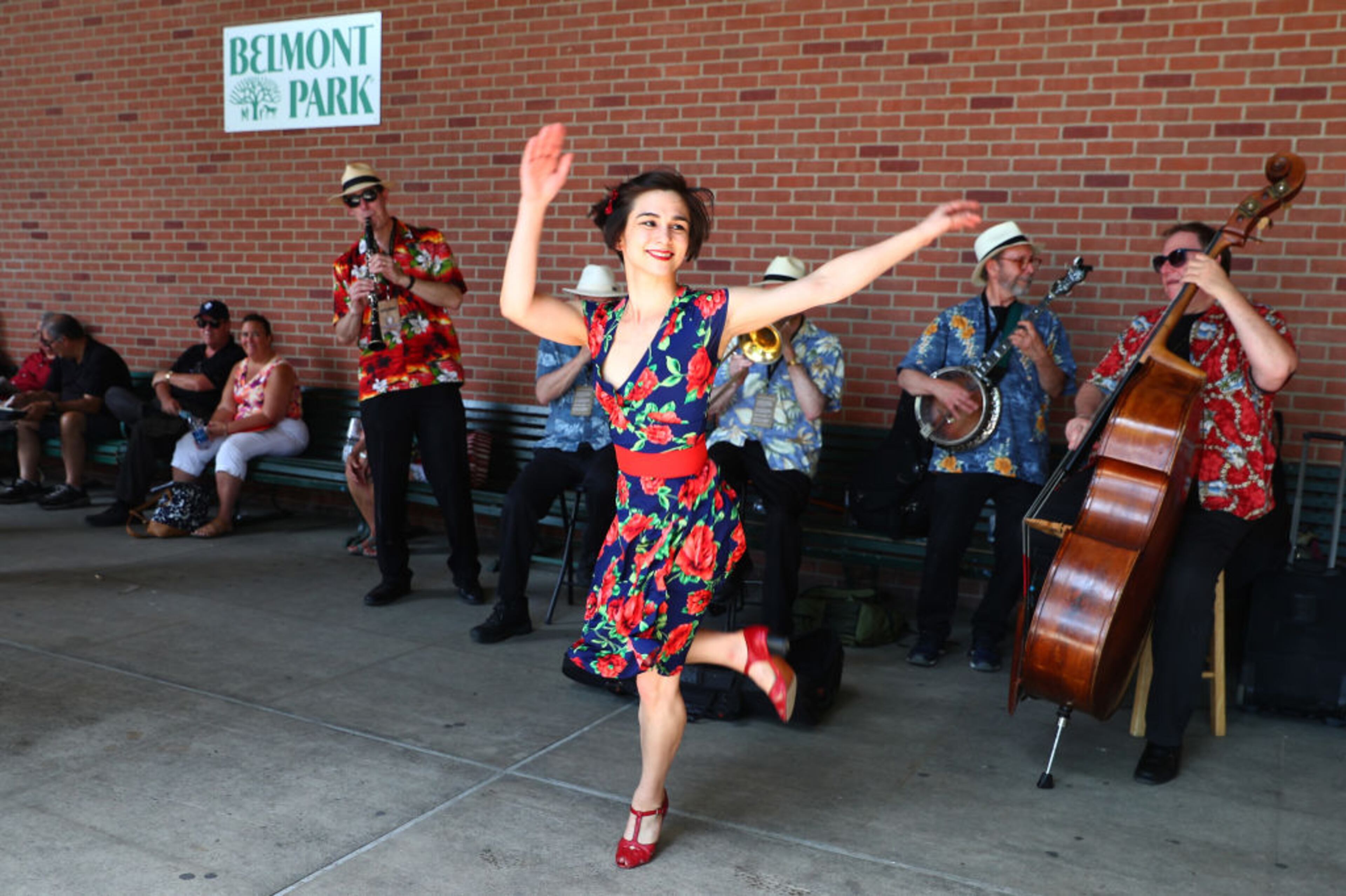 ELMONT, NY - JUNE 09: A dancer performs as a band plays prior to the 150th running of the Belmont Stakes at Belmont Park on June 9, 2018 in Elmont, New York. (Photo by Ed Mulholland/Getty Images)