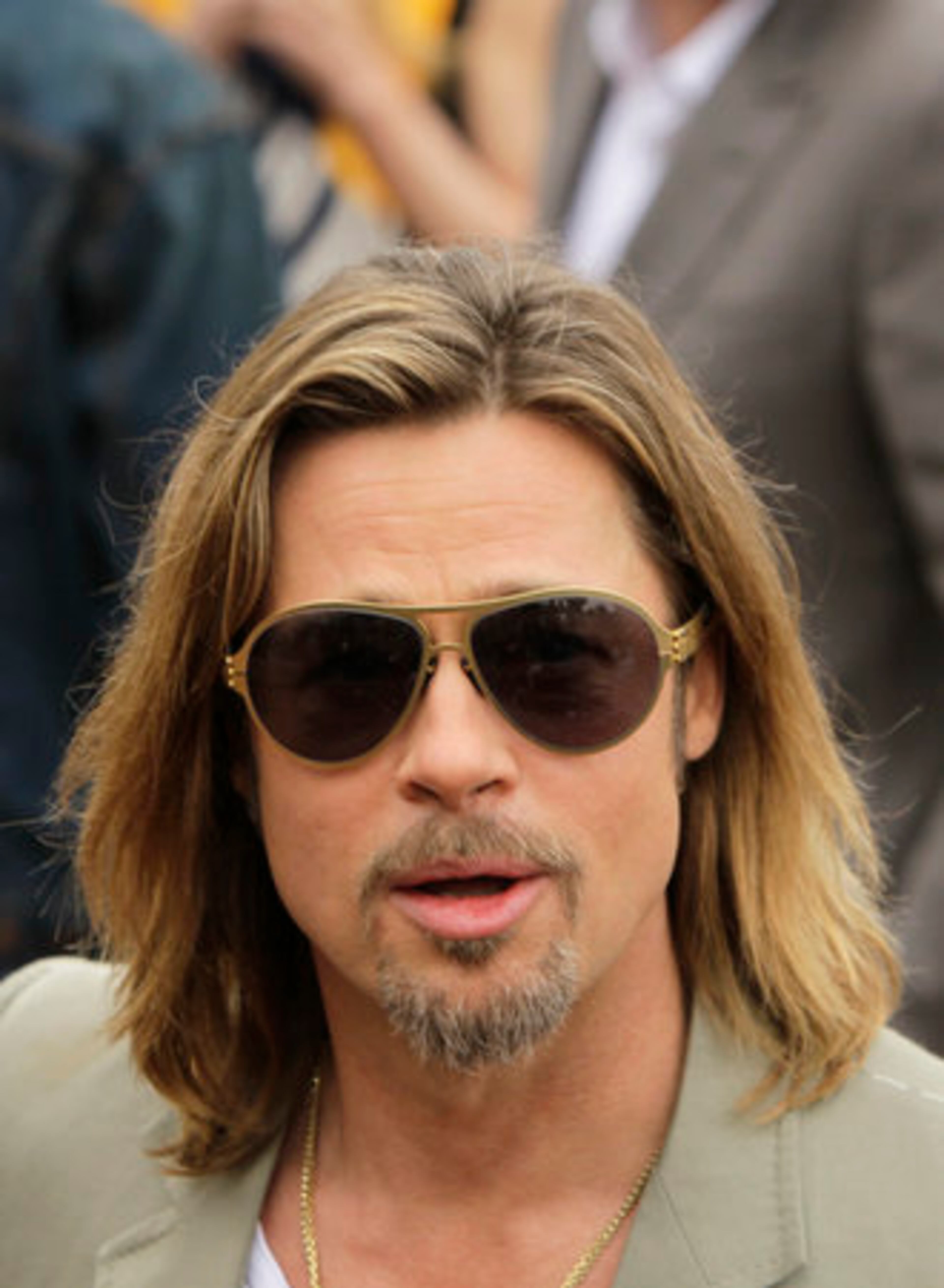 Actor Brad Pitt arrives at a photo call for Killing Them Softly at the 65th international film festival, in Cannes, southern France, Tuesday, May 22, 2012.