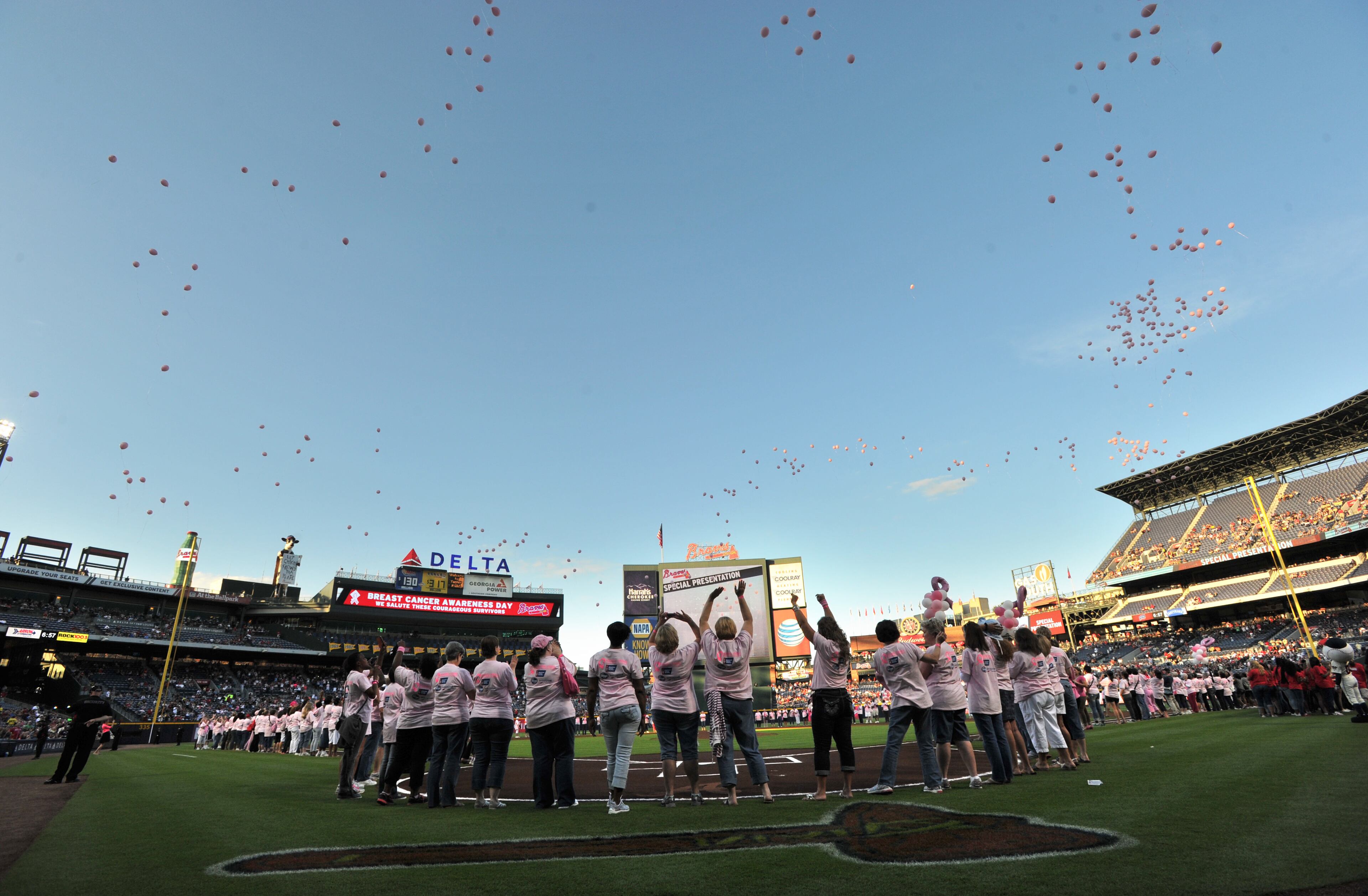 About 300 survivors and their families marched on field during "A Walk in the Park," a pregame ceremony before Atlanta Braves game against the San Diego Padres at Turner Field on Saturday, September 14, 2013. This season, the Braves, WellStar Health System, Kroger and the American Cancer Society Making Strides Against Breast Cancer teamed up for the 7th annual Braves Breast Cancer Awareness Day. The day-long celebration of survivorship honors those who have courageously battled breast cancer, and raised awareness and funds to support research, education and advocacy for cancer patients and their families throughout metro Atlanta.