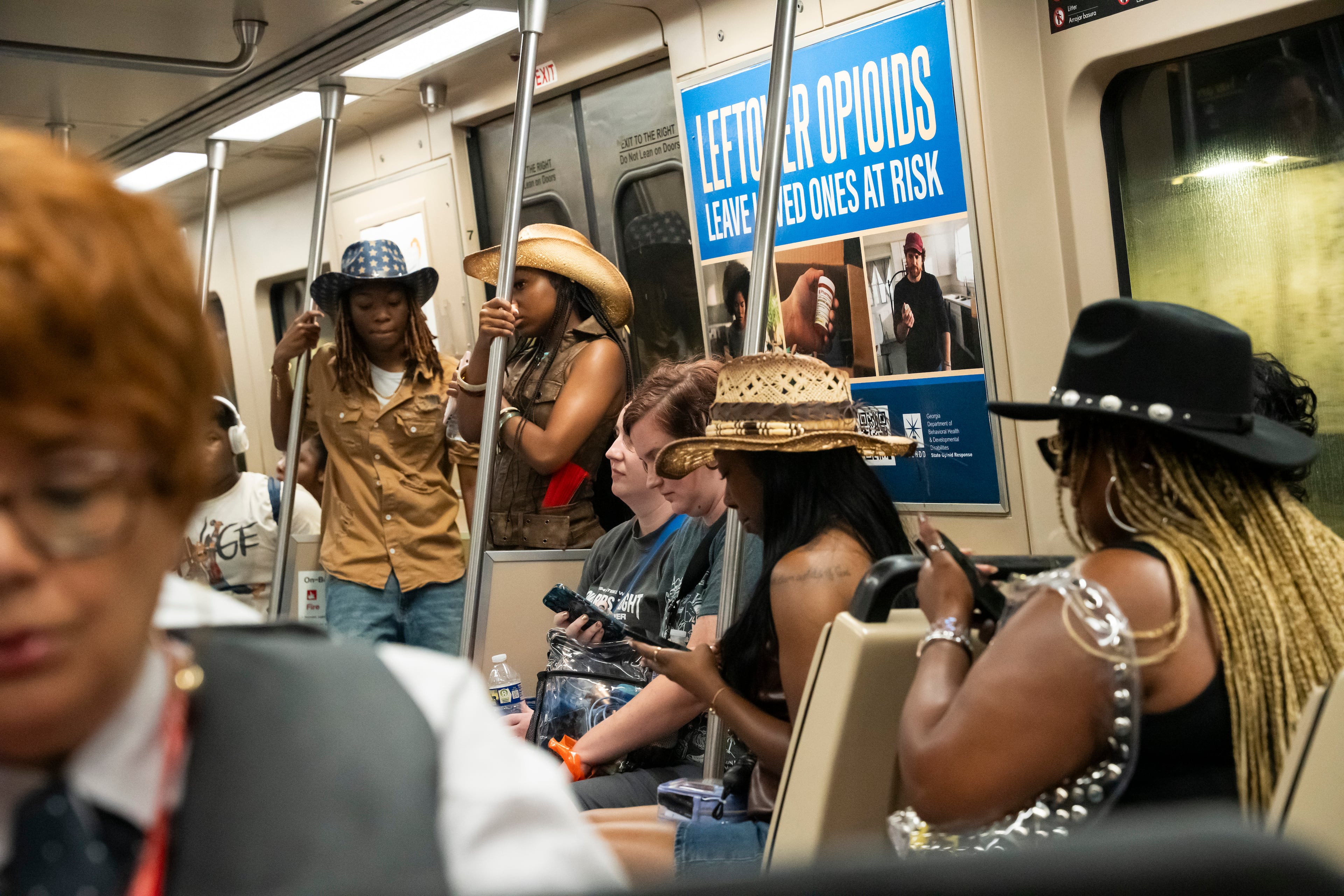 Beyoncé fans dressed in cowboy attire take MARTA to the Cowboy Carter concert at Mercedes-Benz Stadium in Atlanta on Thursday, July 10, 2025. (Olivia Bowdoin for the AJC)