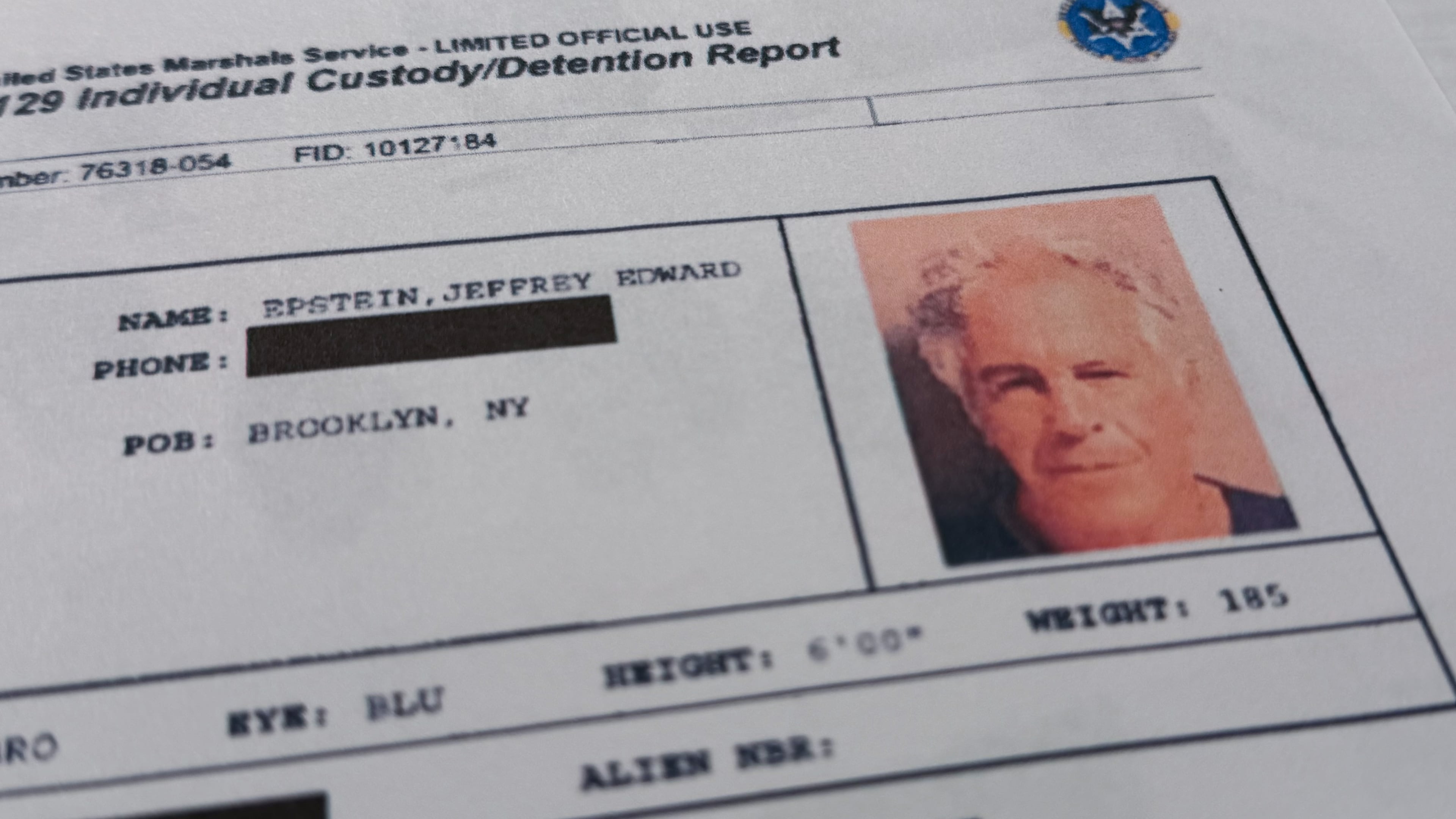 A document that was included in the U.S. Department of Justice release of the Jeffrey Epstein files is photographed Sunday, Feb. 1, 2026, shows the report when Epstein was taken into custody on July 6, 2019. (AP Photo/Jon Elswick)
